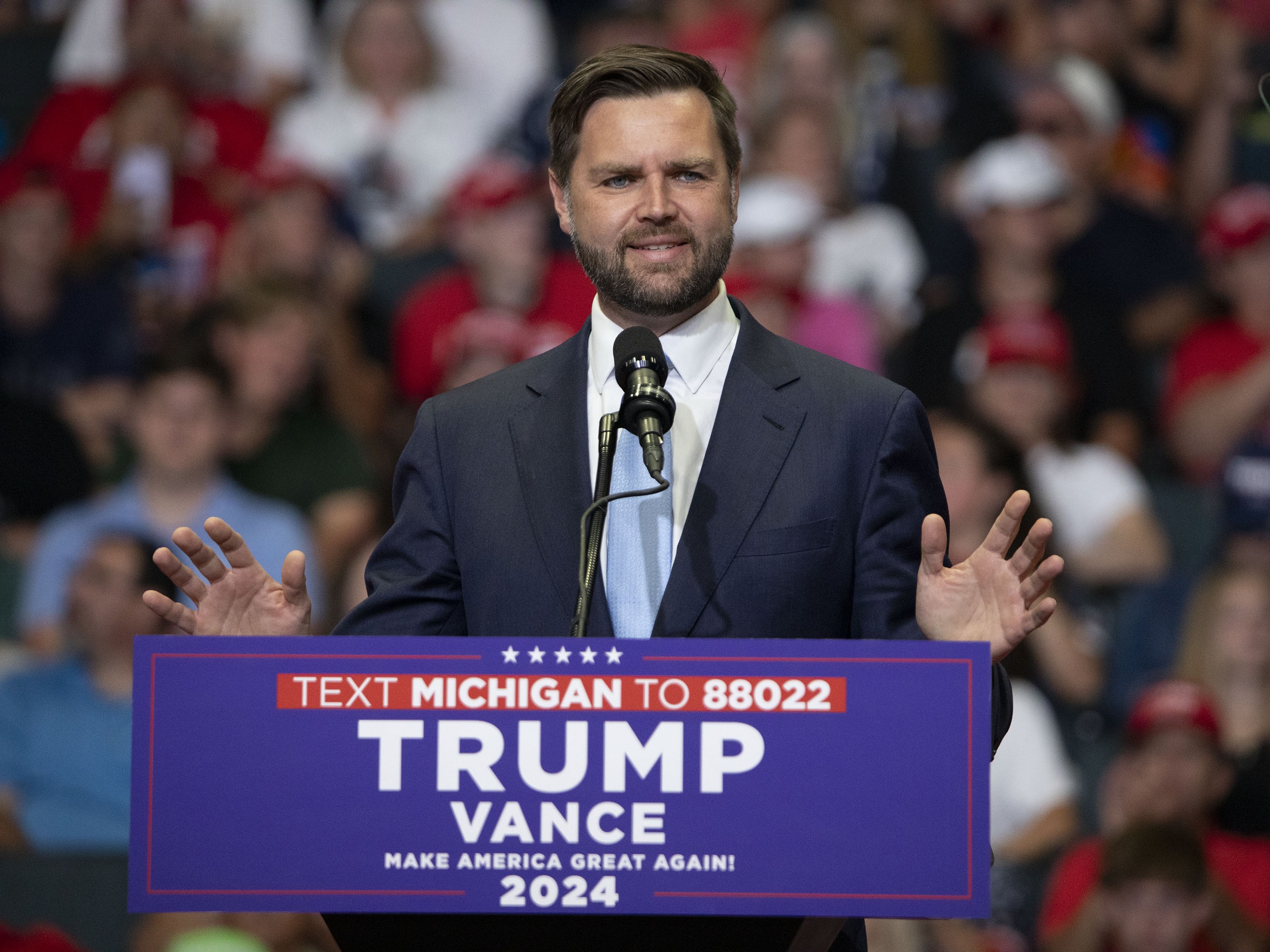 caption: Sen. JD Vance, R-Ohio, the Republican vice presidential candidate, speaks at a rally in Grand Rapids, Mich., on Saturday.