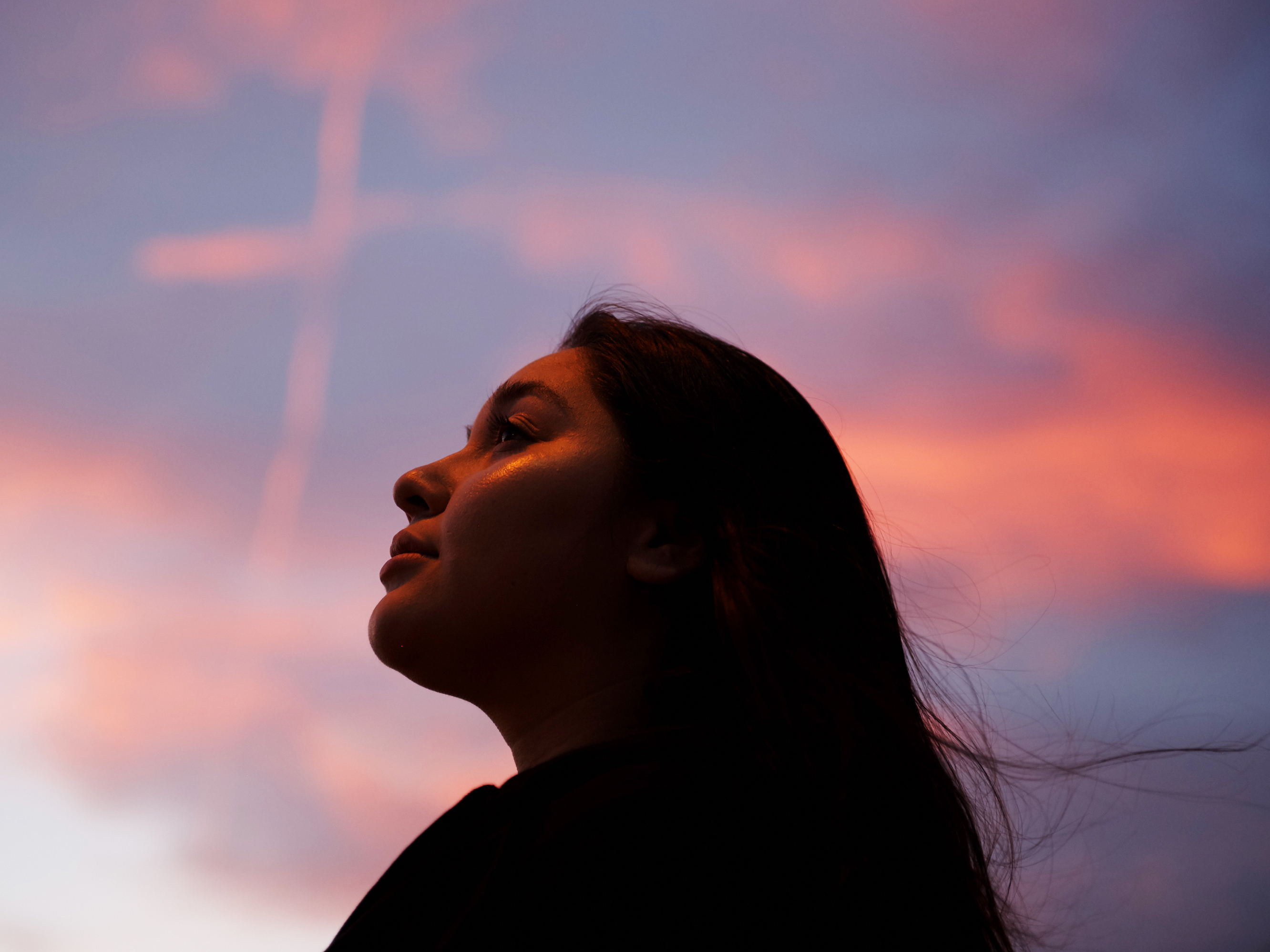 caption: Survivor Susanan Anely stands on the sidewalk bordering the Healing Garden in Las Vegas. Since Route 91, she has moved back to Las Vegas, started a new job, gotten promoted, started school and fallen back in love with photography.