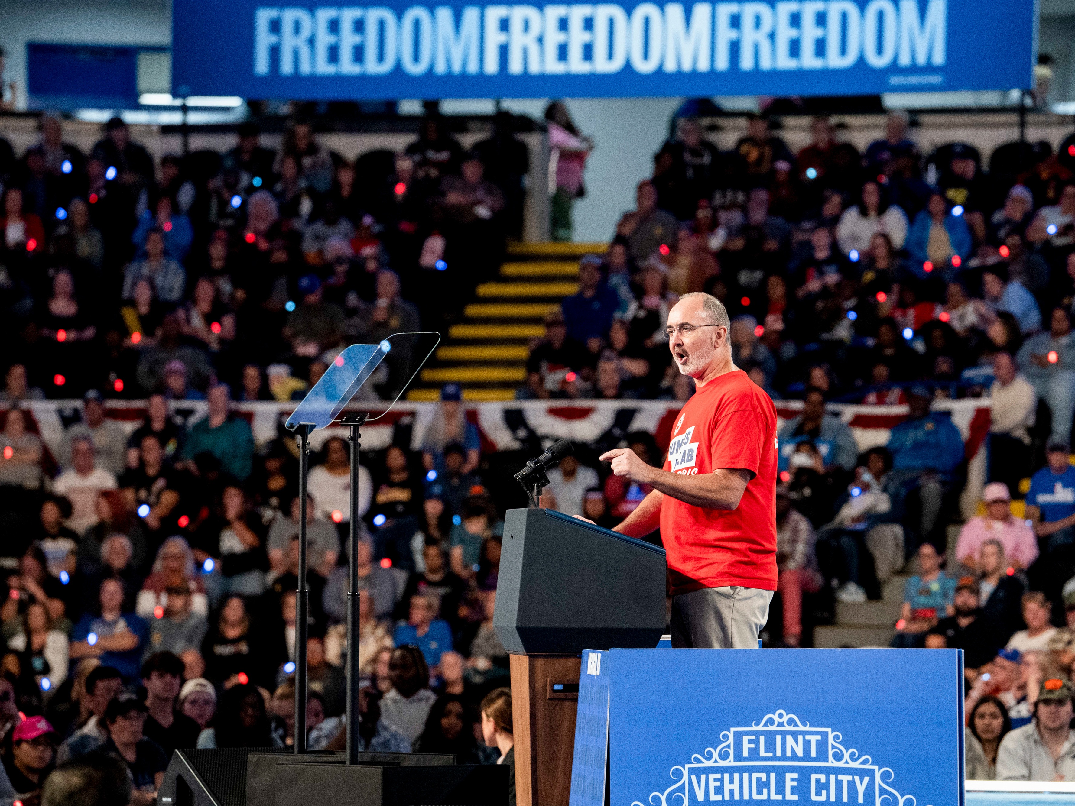 caption: Shawn Fain, president of the United Auto Workers (UAW), during a campaign event with former U.S. Vice President Kamala Harris, in Flint, Mich., on Friday, Oct. 4, 2024.