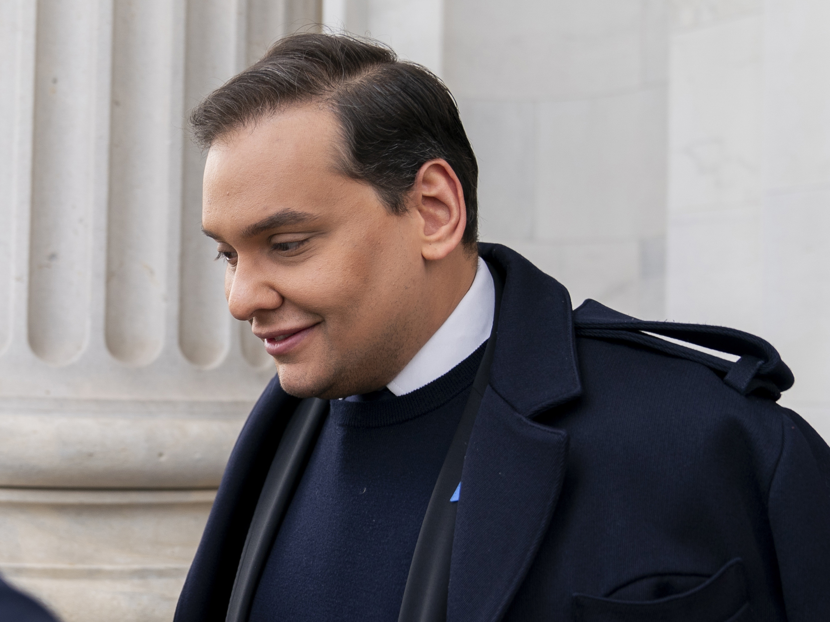 caption: George Santos leaves the Capitol after being expelled from the House of Representatives in Washington on Dec. 1, 2023.