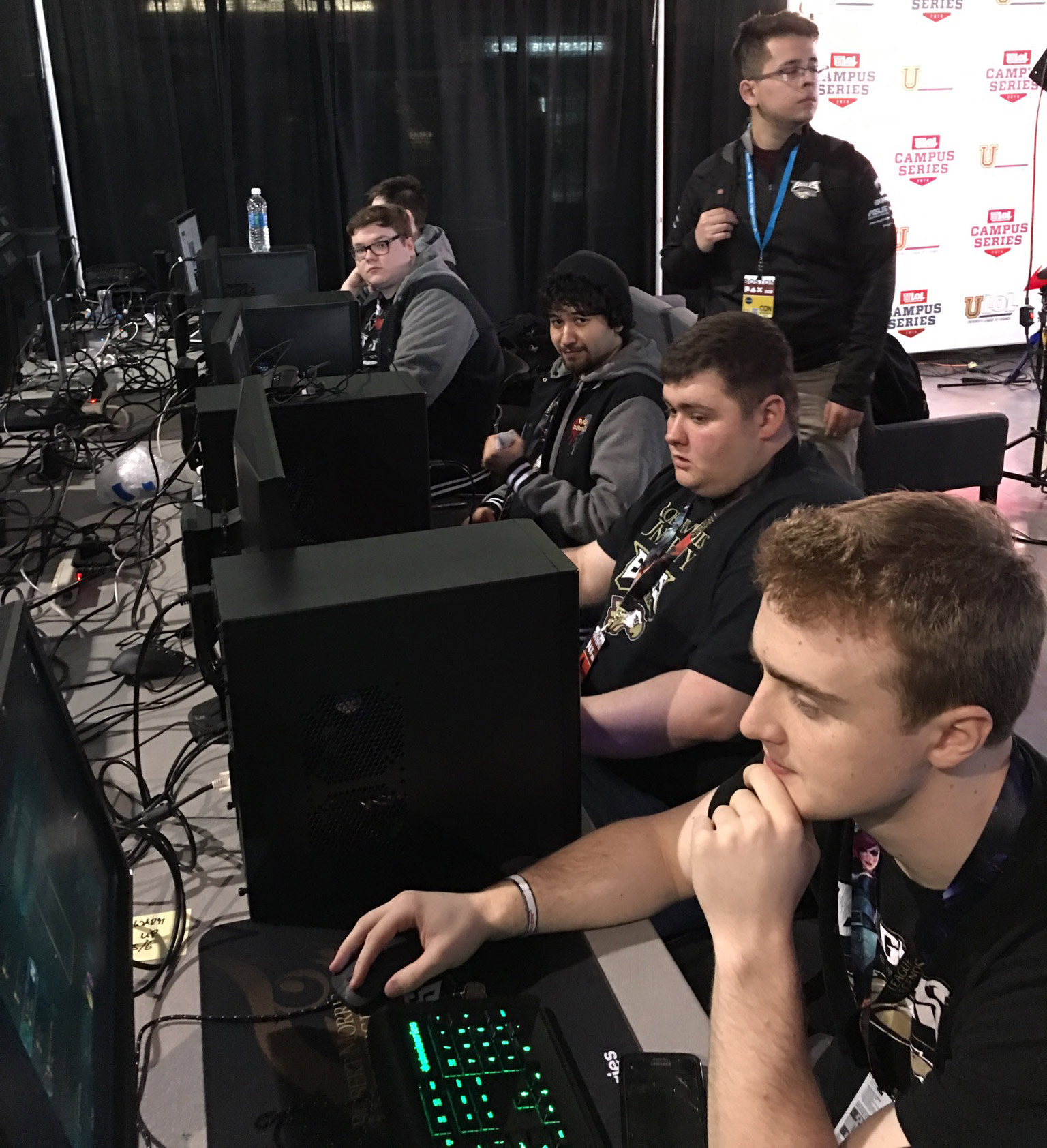 caption: Derek Micheau (bottom) competes in e-sports. He received a scholarship from Robert Morris University for online gaming.