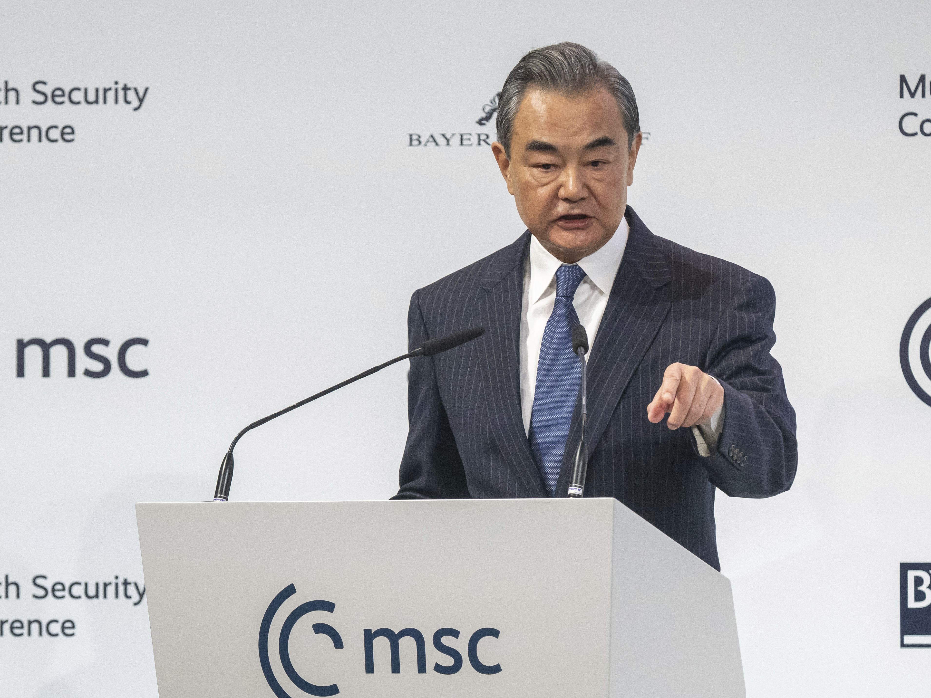 caption: Wang Yi, China's director of the Office of the Central Foreign Affairs Commission, speaks during the Munich Security Conference in Munich, Germany, Feb. 18, 2023. One year into Russia's war against Ukraine, China is offering a 12-point proposal to end the fighting.