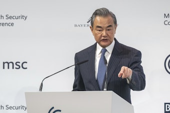 caption: Wang Yi, China's director of the Office of the Central Foreign Affairs Commission, speaks during the Munich Security Conference in Munich, Germany, Feb. 18, 2023. One year into Russia's war against Ukraine, China is offering a 12-point proposal to end the fighting.