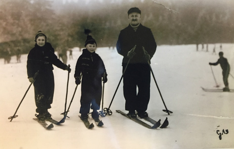 caption: Werner as a child, on a ski trip in Germany with his father and older sister.