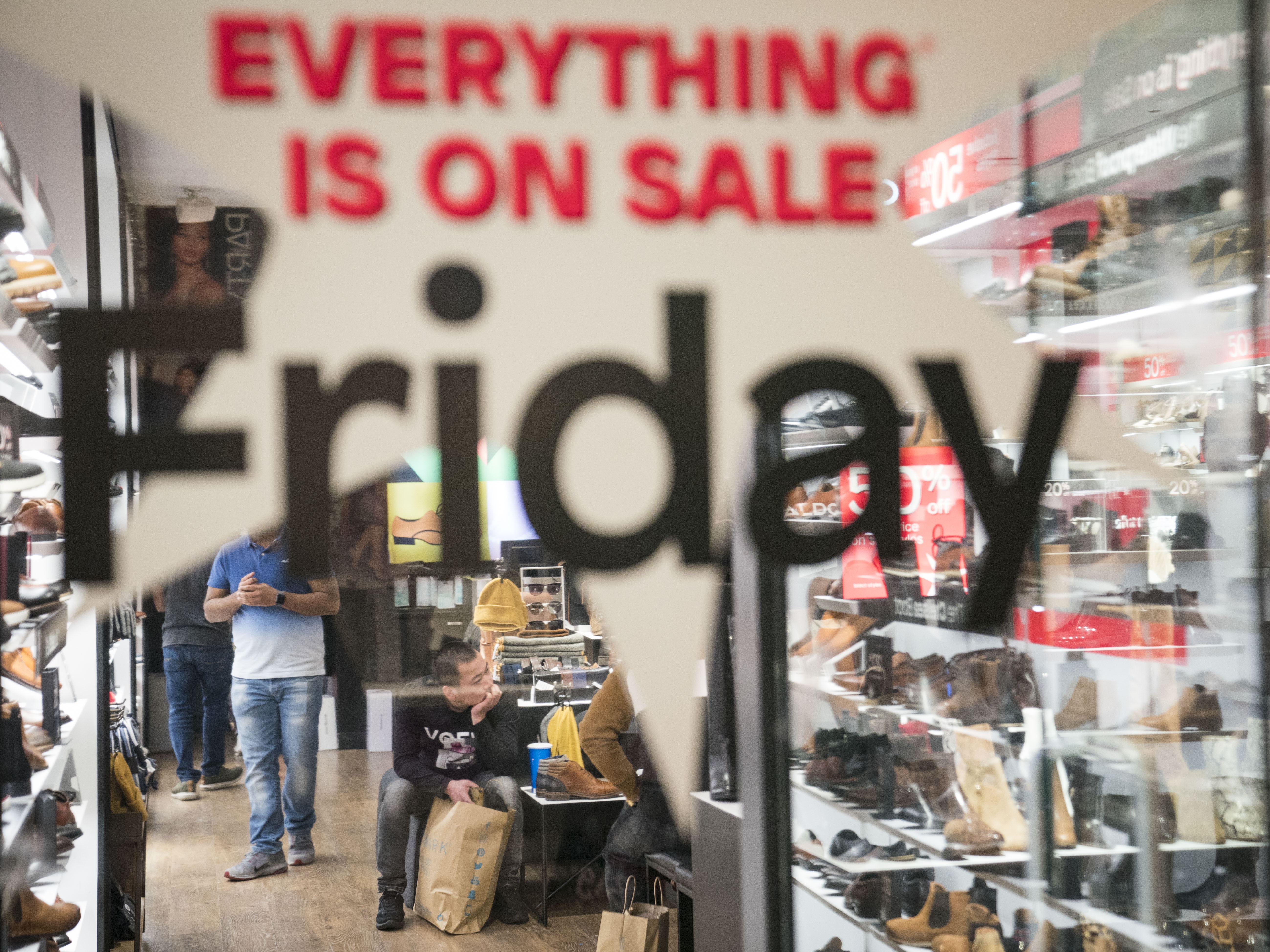 caption: Deals are the name of the game this holiday season as more people are planning to shop between Black Friday and Cyber Monday.