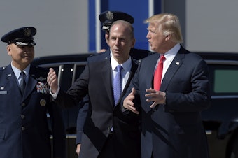 caption: President Donald Trump talks with Boeing CEO Dennis Muilenburg upon his arrival on Air Force One at Charleston International Airport in North Charleston, S.C., Friday, Feb. 17, 2017.