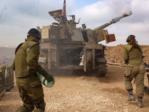 caption: An Israeli artillery unit is pictured near the border with the Gaza Strip on Tuesday, amid continuing battles between Israel and the militant group Hamas.