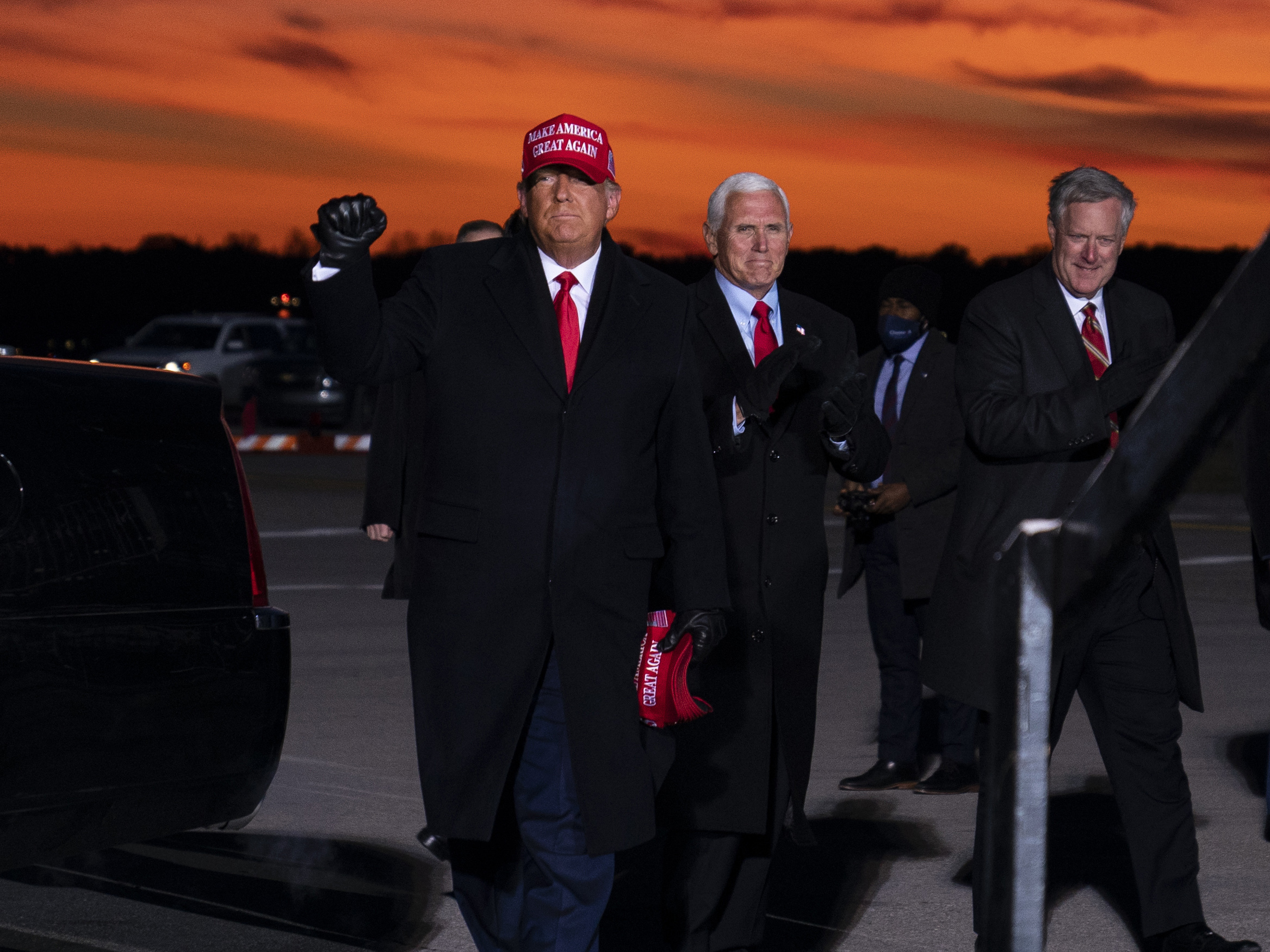 caption: Mark Meadows, right, traveled with President Trump and Vice President Pence in the homestretch of the campaign, including to a rally in Traverse City, Mich. on Nov. 2.