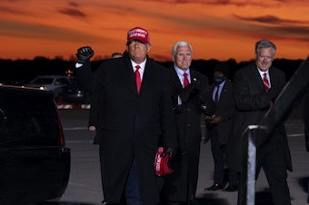 caption: Mark Meadows, right, traveled with President Trump and Vice President Pence in the homestretch of the campaign, including to a rally in Traverse City, Mich. on Nov. 2.