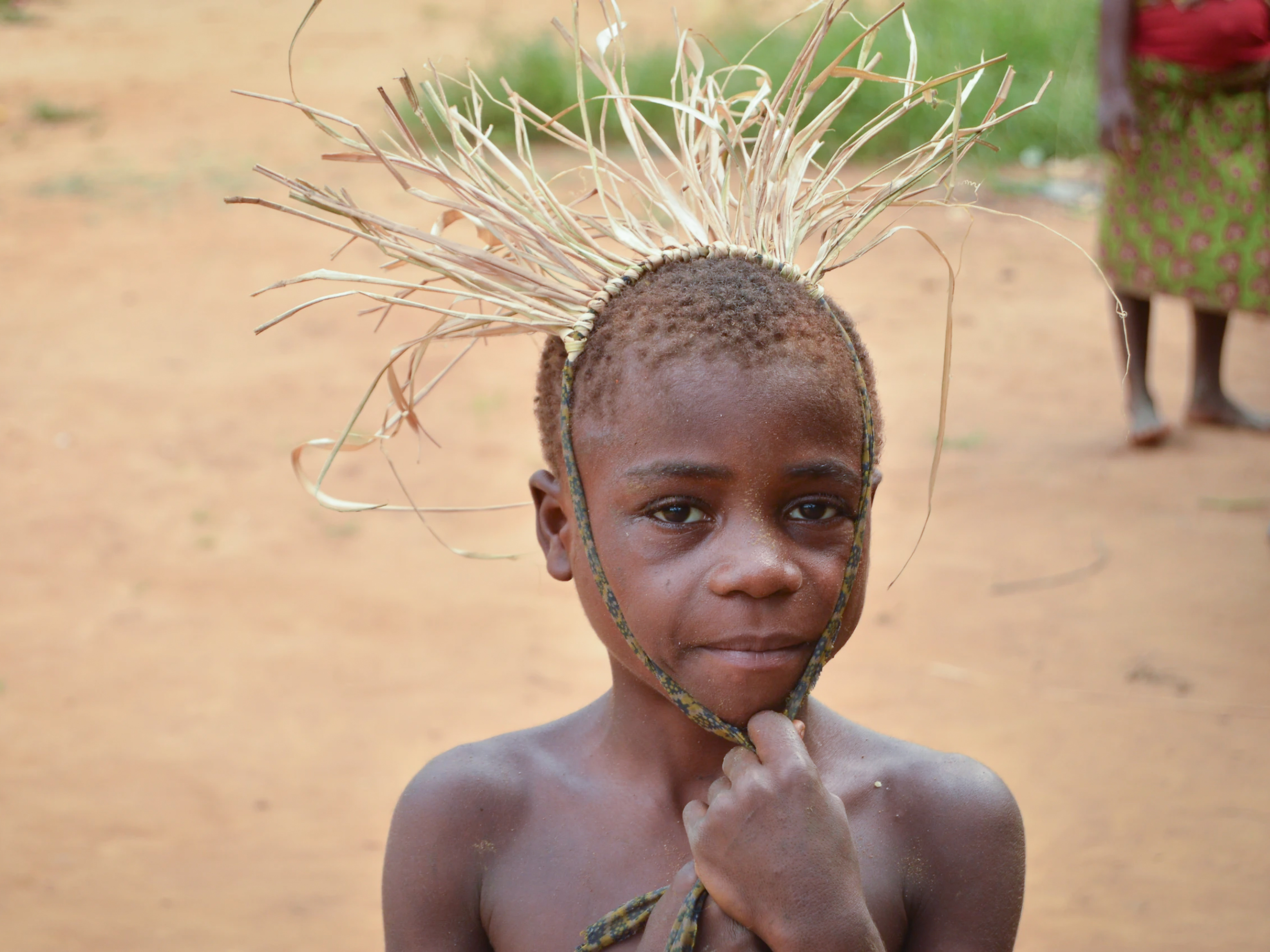 caption: A child from the Mbendjele people, a hunter-gatherer community that lives in the northern rainforests of the Republic of Congo. A new study found that children in this society have on average 8 caregivers in addition to the mother to provide hands-on attention.