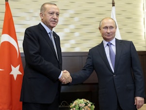 caption: Russian President Vladimir Putin (right) and Turkish President Recep Tayyip Erdogan pose for a photo during their meeting in Sochi, Russia, Tuesday.