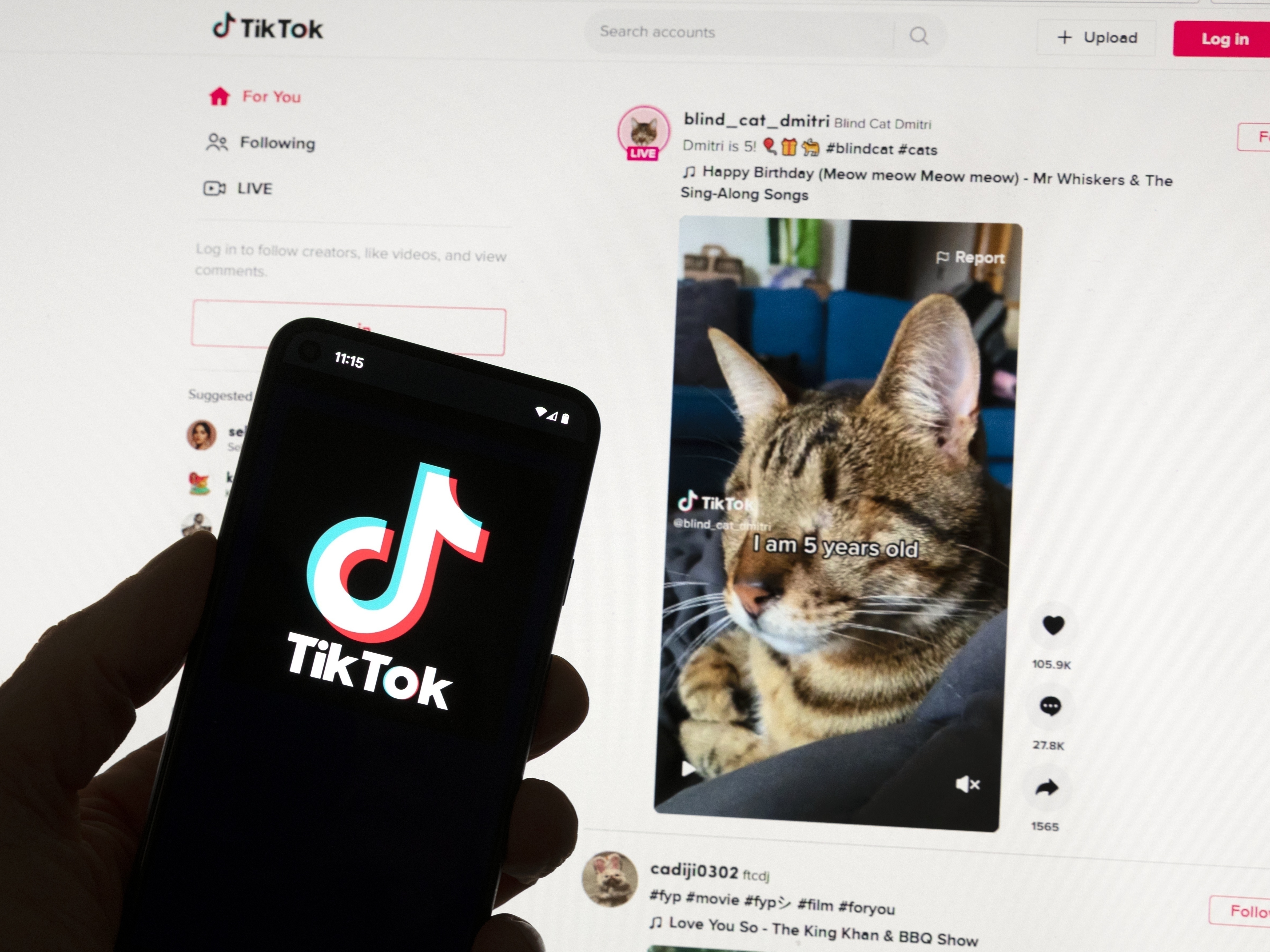 caption: "Brain rot" is the term of the year for 2024, referring to concerns that endlessly scrolling through social media videos and other content can cause harm. Here, TikTok's logo is seen on a mobile phone in front of a computer screen showing a TikTok home screen. (AP Photo/Michael Dwyer, File)