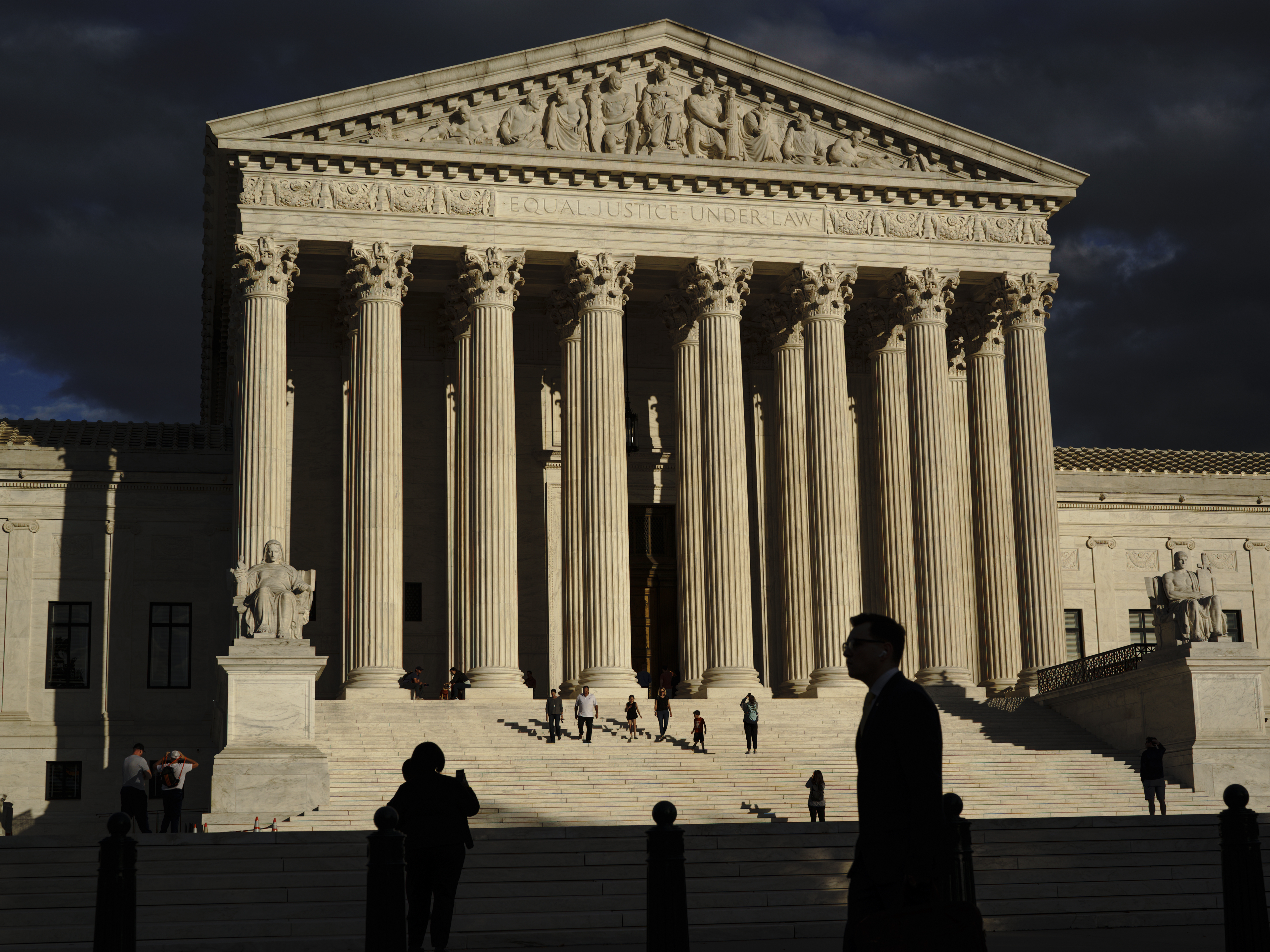 caption: The U.S Supreme Court building is seen at dusk in Washington on Oct. 22, 2021.