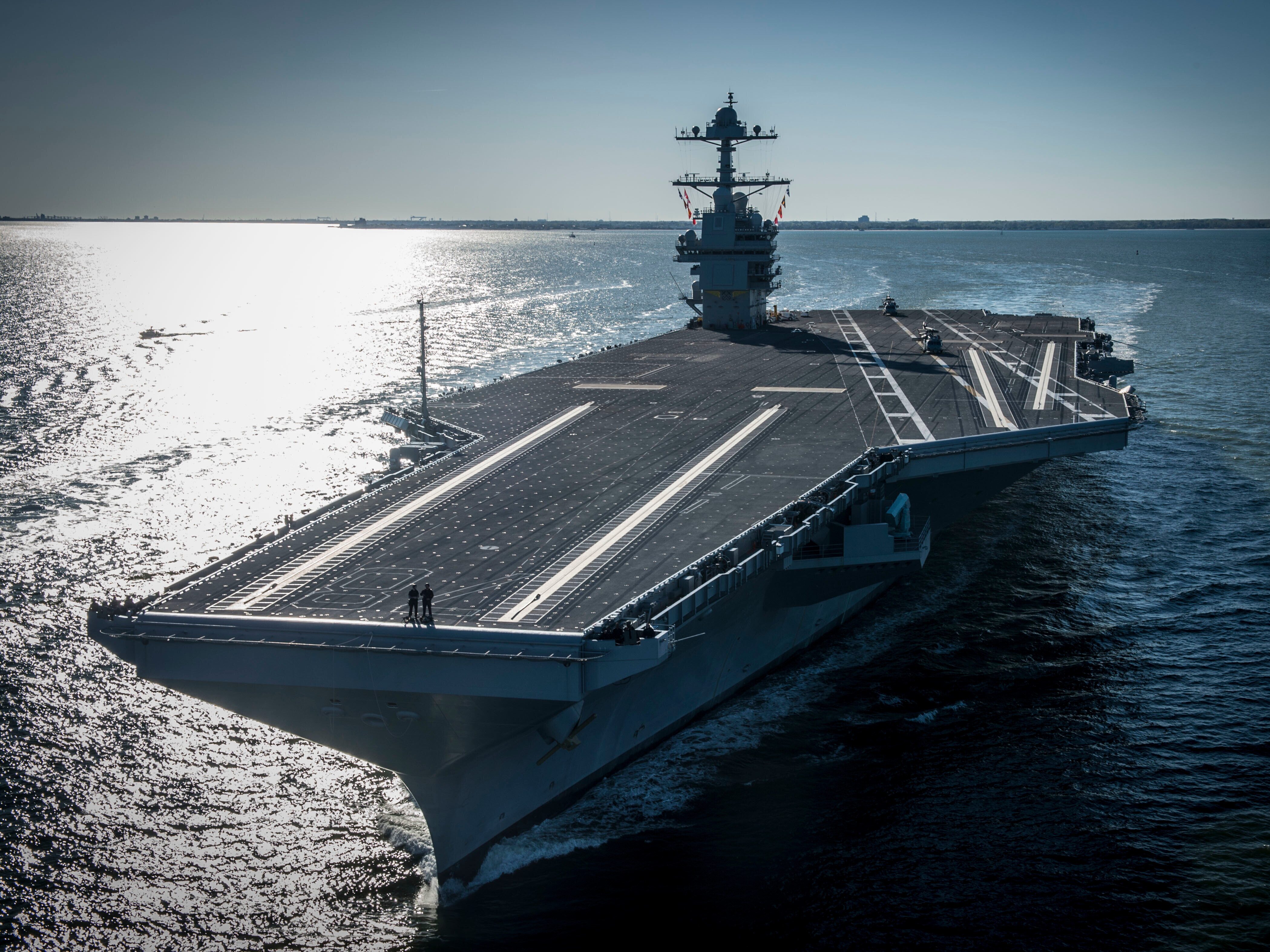 caption: In this photo provided by the U.S. Navy, the USS Gerald R. Ford embarked on the first of its sea trials to test various state-of-the-art systems on its own power for the first time, April 8, 2017, from Newport News, Va.