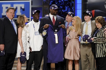 caption: Members of the Tuohy family are speaking out after former NFL player Michael Oher alleged that they earned millions from pushing a false narrative that they adopted him. Here, Oher poses for a photograph with the Tuohy family at Radio City Music Hall for the 2009 NFL Draft on April 25, 2009 in New York City.