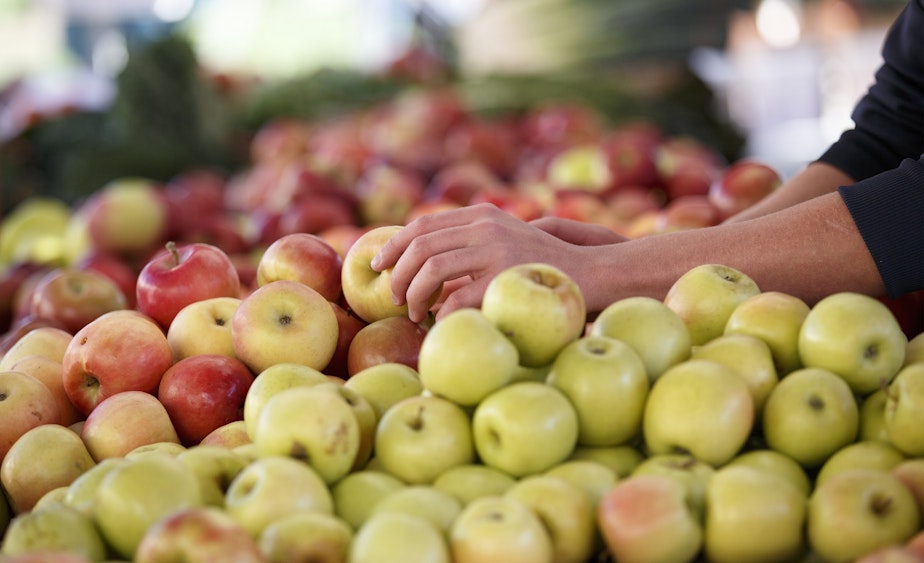 caption: In this photo taken Oct. 5, 2014, apples are displayed at a farmers market in Arlington, Va. A common pesticide used on citrus fruits, almonds and other crops would be banned under a proposal announced Friday by the Environmental Protection Agency. The proposal would prohibit use of chlorpyrifos, a widely used insecticide that is sprayed on a variety of crops including oranges, apples, cherries, grapes, broccoli and asparagus. 