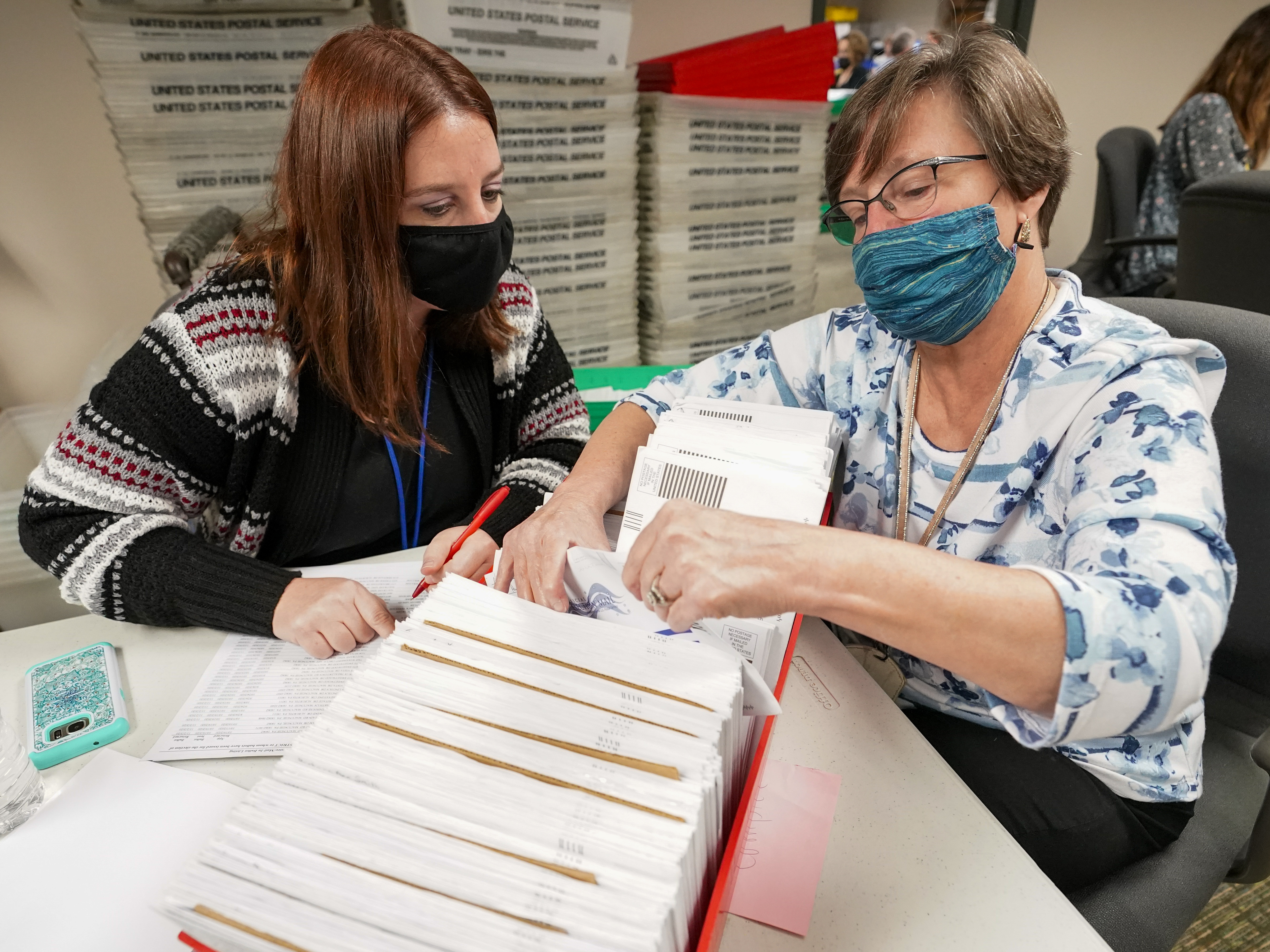 caption: Lehigh County workers count ballots as vote counting in the general election continues on Thursday in Allentown, Pa.