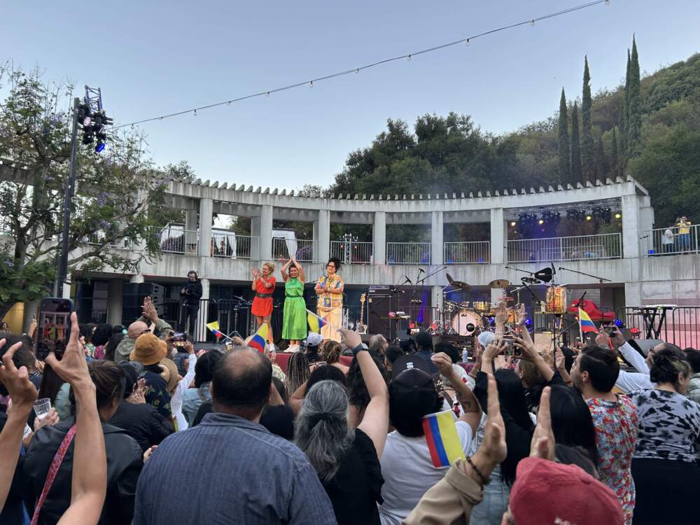 caption: La Perla after their performance in Los Angeles. (Betto Arcos)