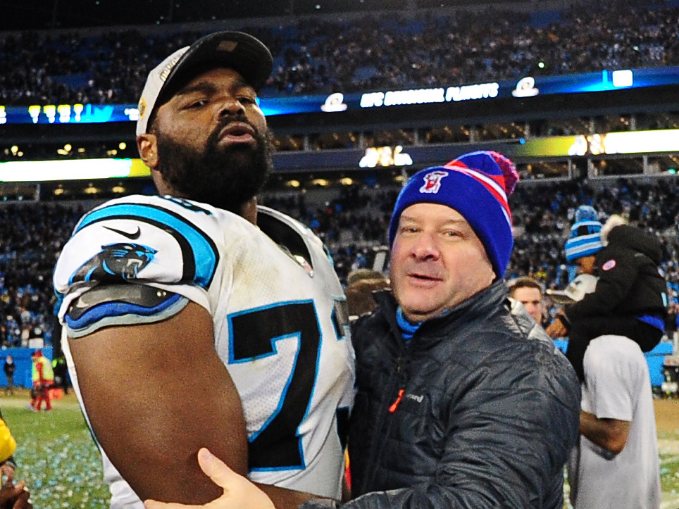 caption: Michael Oher of the Carolina Panthers celebrates with his family after the NFC Championship Game against the Arizona Cardinals at Bank Of America Stadium on January 24, 2016 in Charlotte, N.C.