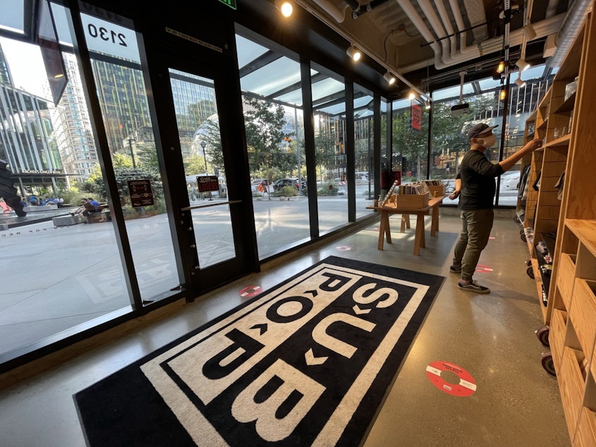 caption: A customer browses in Subpop's pop-up store on Amazon's campus
