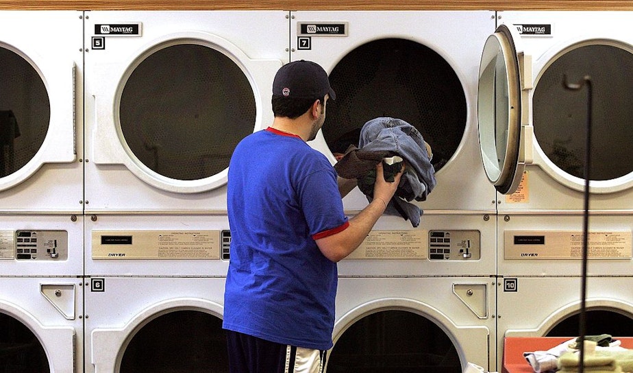 caption: A man at a Maytag laundromat in Mount Prospect, Illinois. (Tim Boyle/Getty Images)