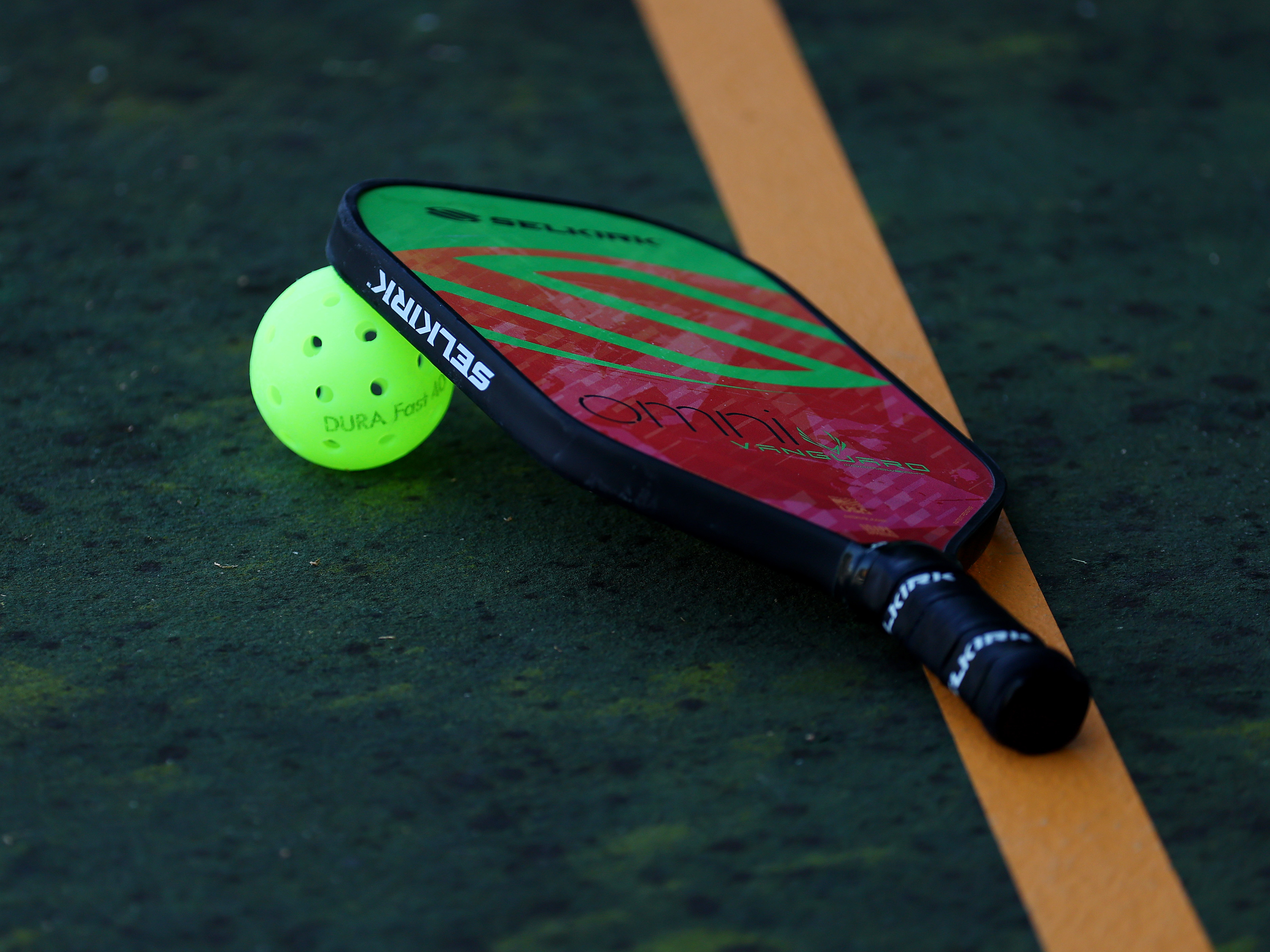 caption: Does the pop, pop, pop noise of pickleball annoy or entice you?