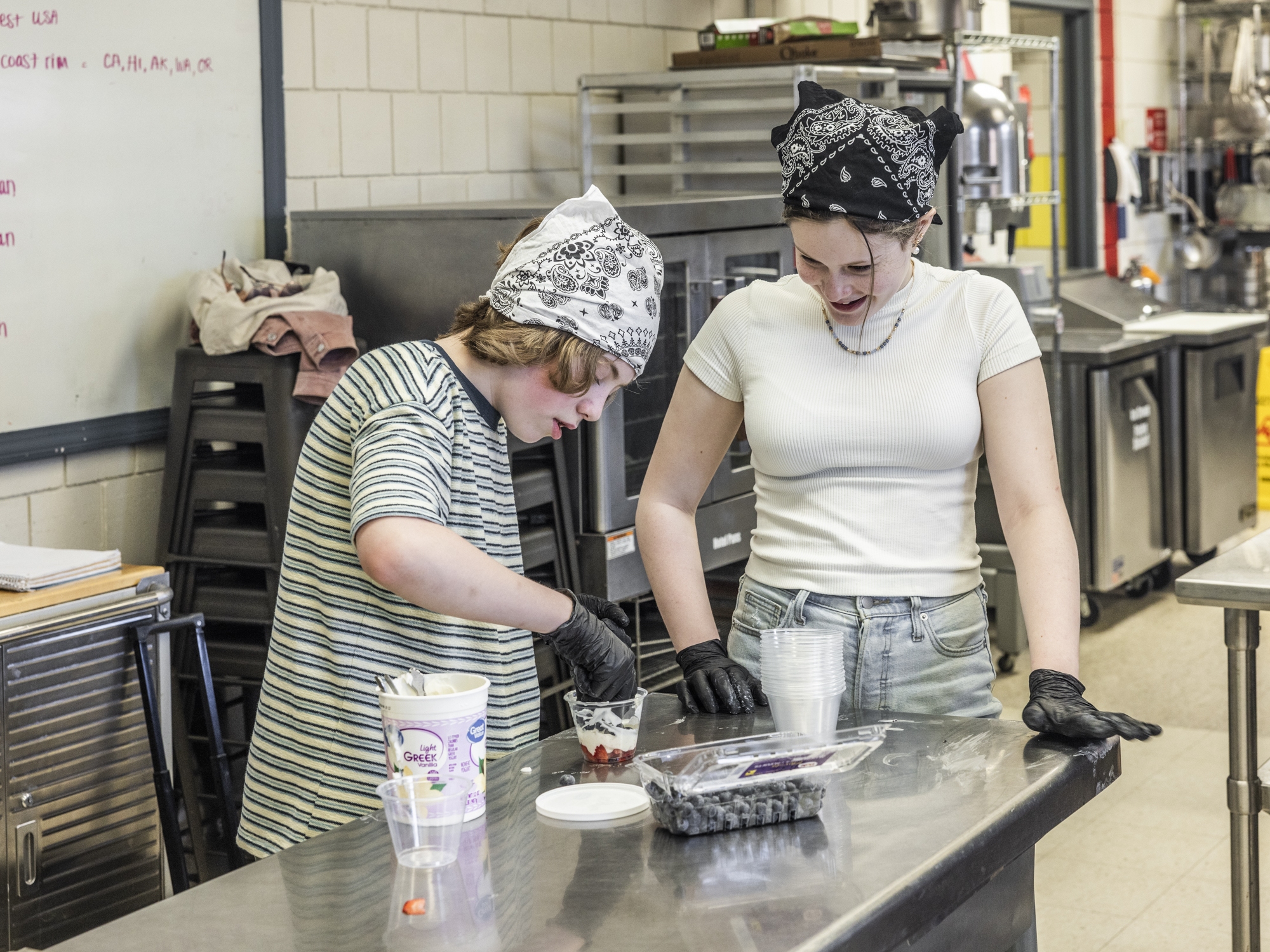 caption: Sixth graders Connor Atkinson and Genevieve Plante work together to make yogurt parfaits in the after-school cooking club in their rural Maine school district.