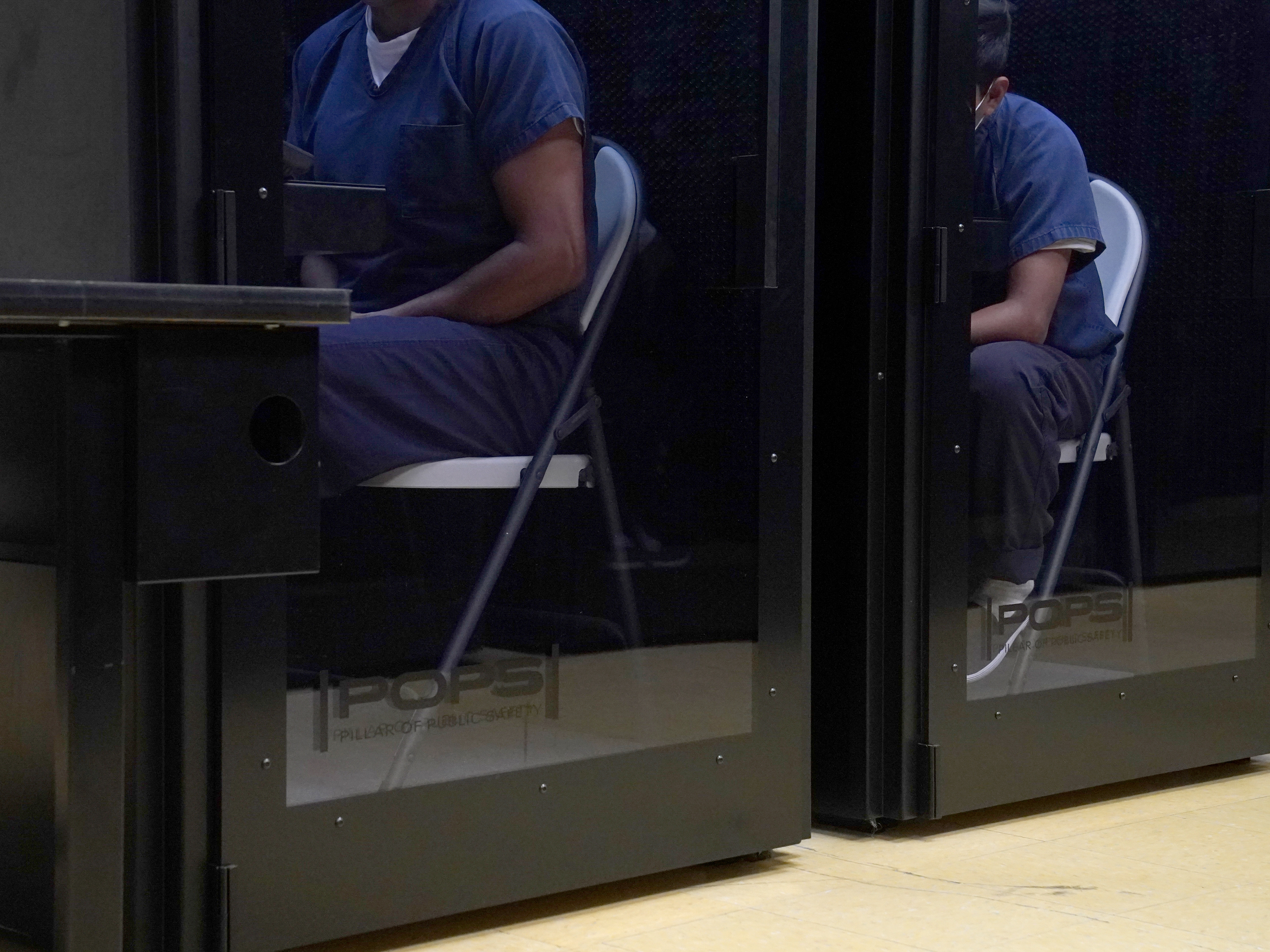 caption: Detainees do a virtual visit with their attorneys or asylum officers during a media tour at the Port Isabel Detention Center hosted by U.S. Immigration and Customs Enforcement (ICE) Harlingen Enforcement and Removal Operations (ERO) on June 10, 2024 in Los Fresnos, Texas.