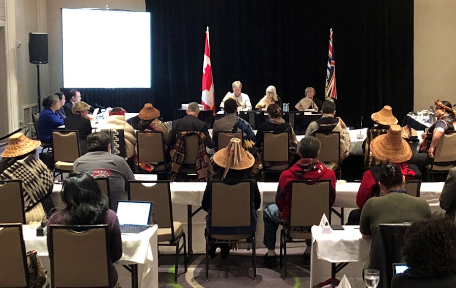 caption: Traditional cedar hats abound as Washington tribal leaders speak at an "oral traditional evidence" hearing held by the National Energy Board in Victoria, B.C.