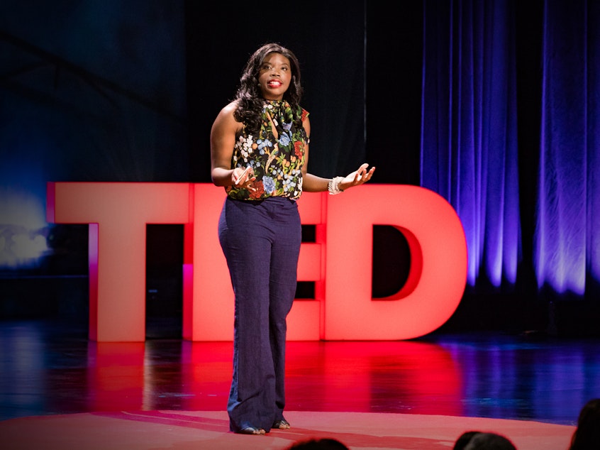 caption: Liz Ogbu on the TED stage.