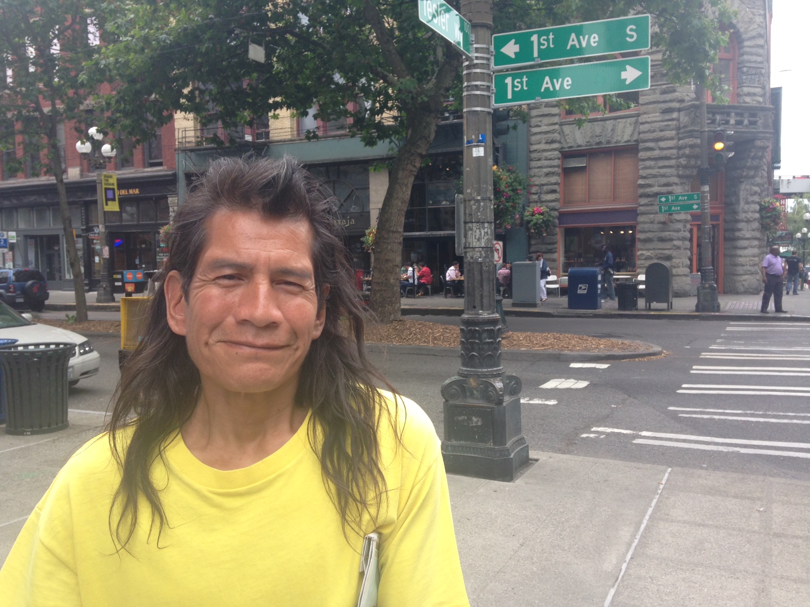 caption: Robert Surles sells Real Change, Seattle's homeless paper, at First Avenue and Yesler Way.