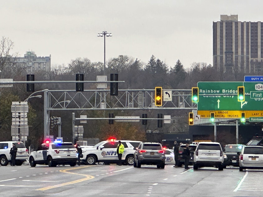 caption: Law enforcement personnel block off the entrance to the Rainbow Bridge border crossing on Wednesday in Niagara Falls, N.Y., after a vehicle exploded at a checkpoint.