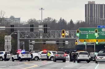 caption: Law enforcement personnel block off the entrance to the Rainbow Bridge border crossing on Wednesday in Niagara Falls, N.Y., after a vehicle exploded at a checkpoint.