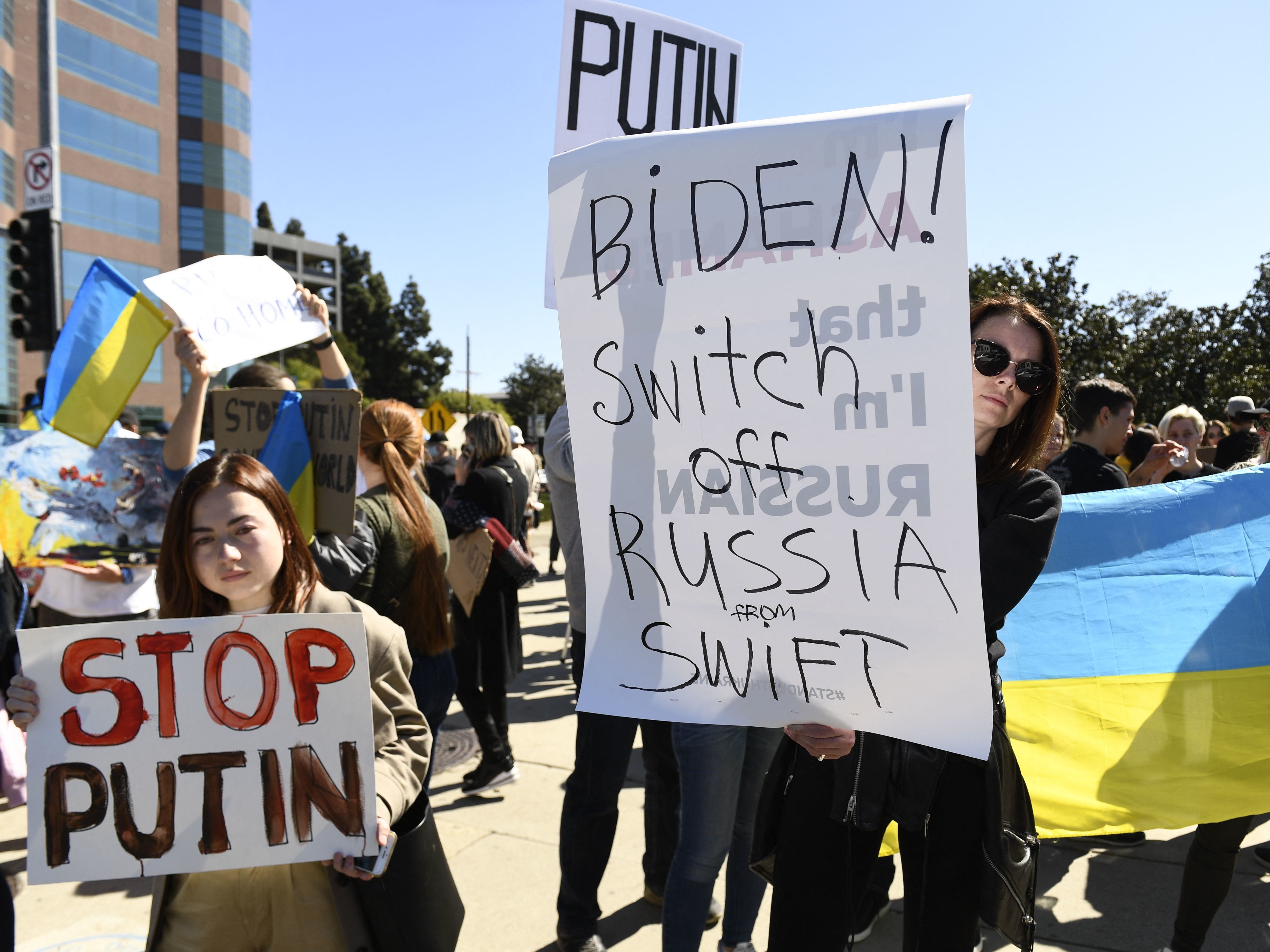 caption: Demonstrators protest in support of Ukraine, in Los Angeles, on February 24, 2022.