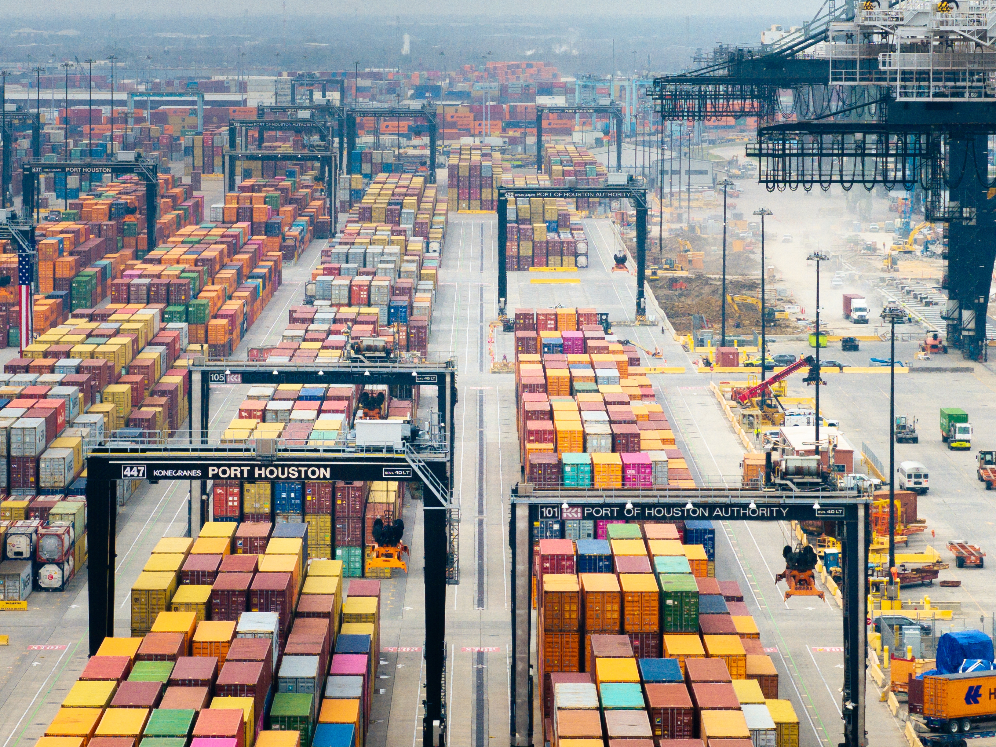 caption: Shipping containers sit at the Port of Houston in Texas last month. A raft of new tariffs on imports from China, Canada and Mexico has companies and consumers scrambling.