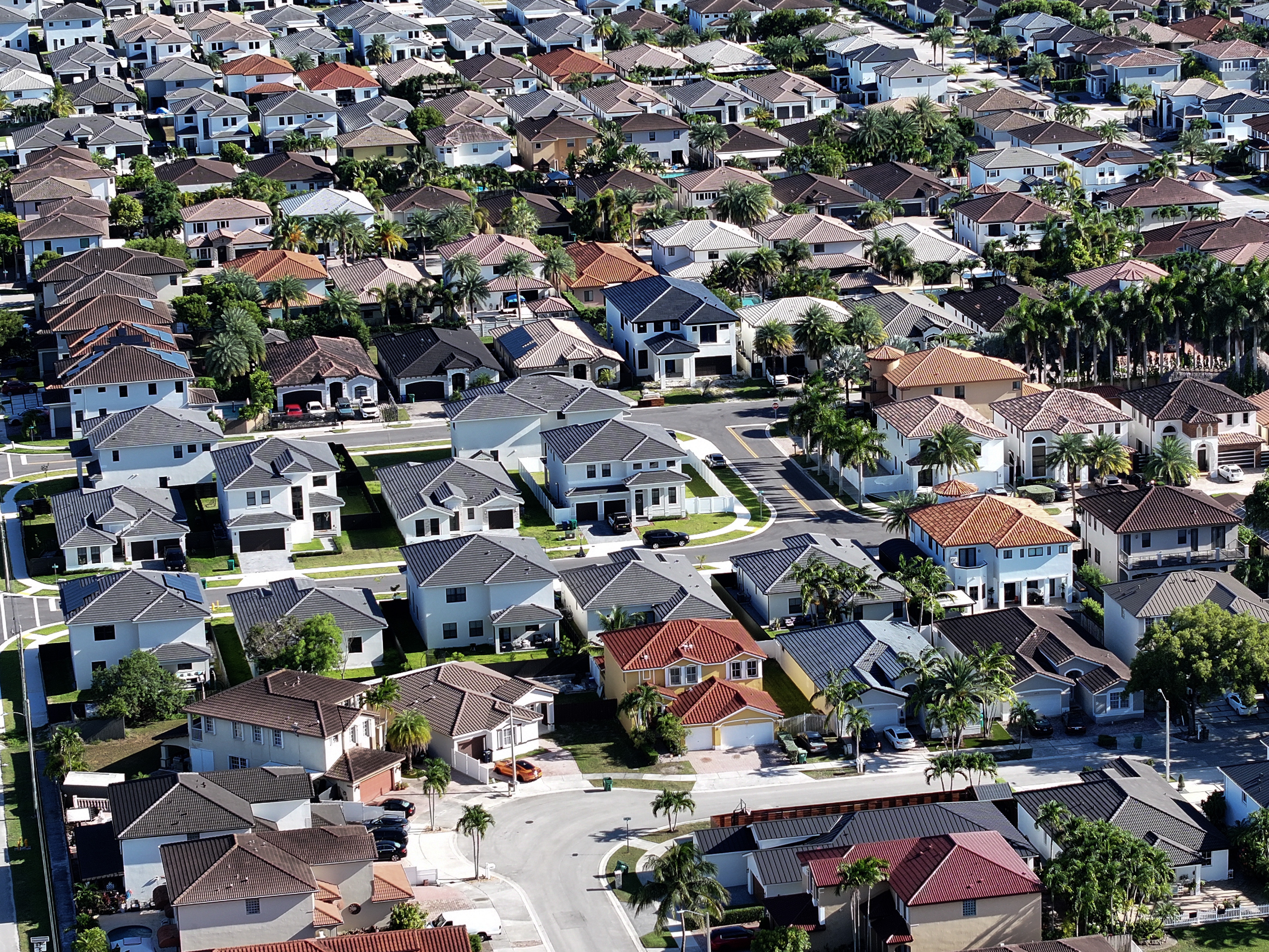 caption: An aerial view of single family homes earlier this month in Miami.