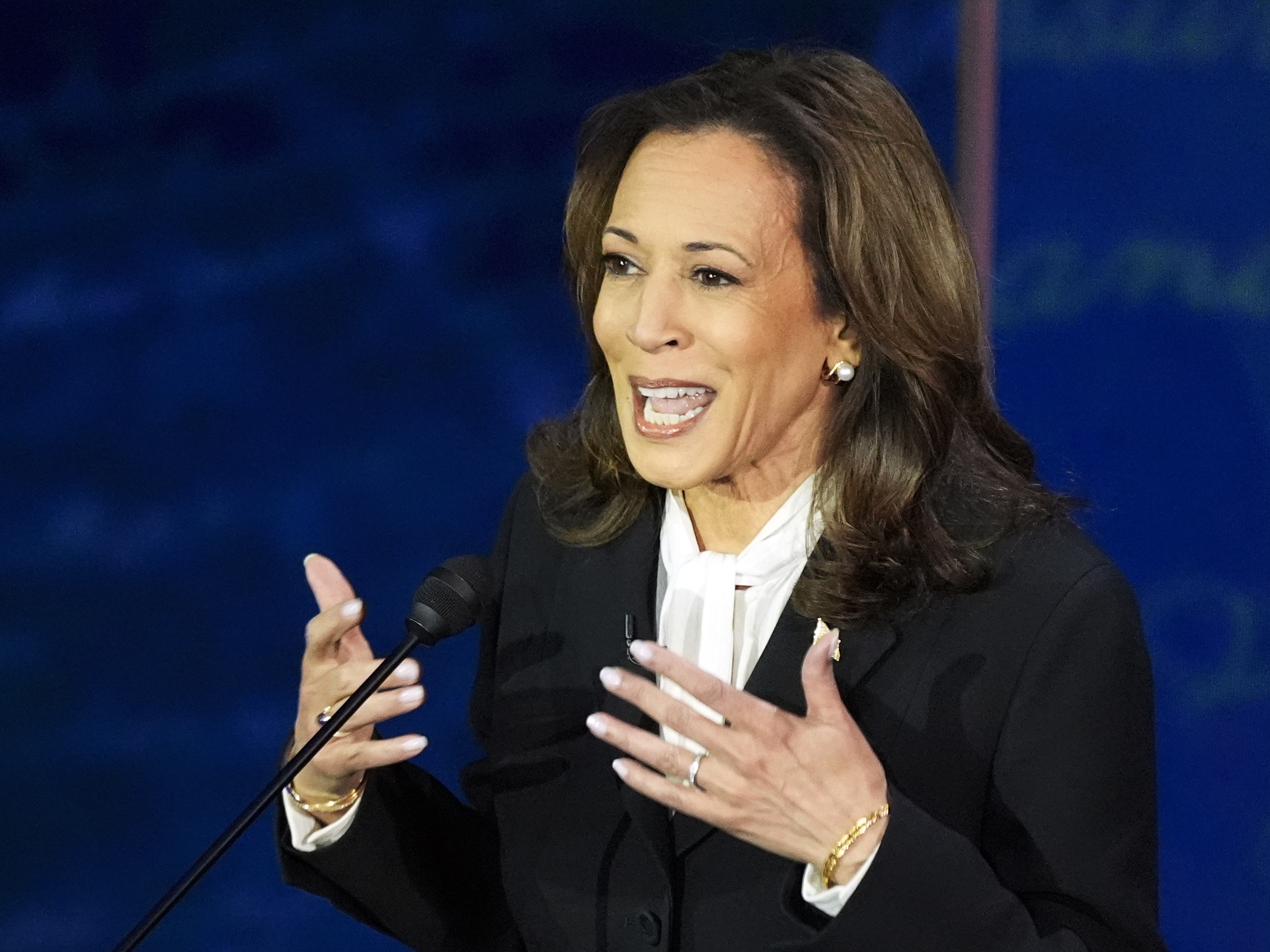 caption: Democratic presidential nominee Vice President Kamala Harris speaks during a presidential debate with Republican presidential nominee former President Donald Trump at the National Constitution Center in Philadelphia.