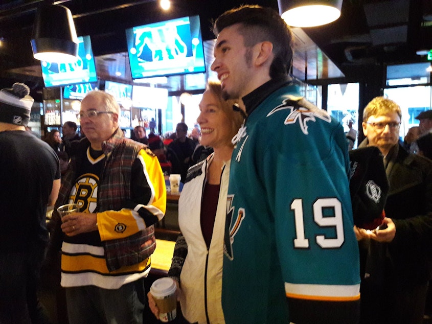 caption: Mayor Jenny Durkan with hockey fans at Henry's Tavern on Tuesday, December 4, 2018. She announced to the crowd that Seattle had been awarded a hockey team from the NHL.
