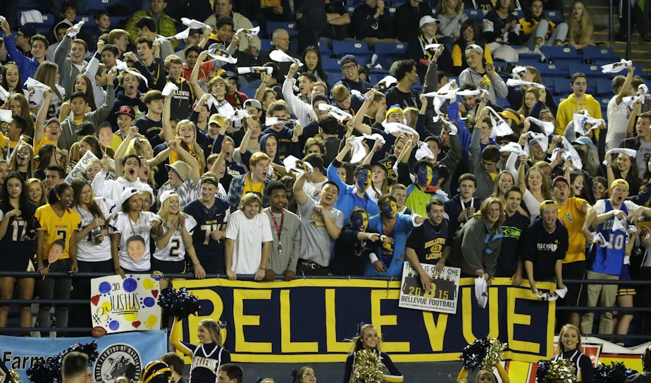 caption: Bellevue High School fans cheer during the first half of the team's Class 3A high school football championship game against Eastside Catholic, Friday, Dec. 4, 2015.