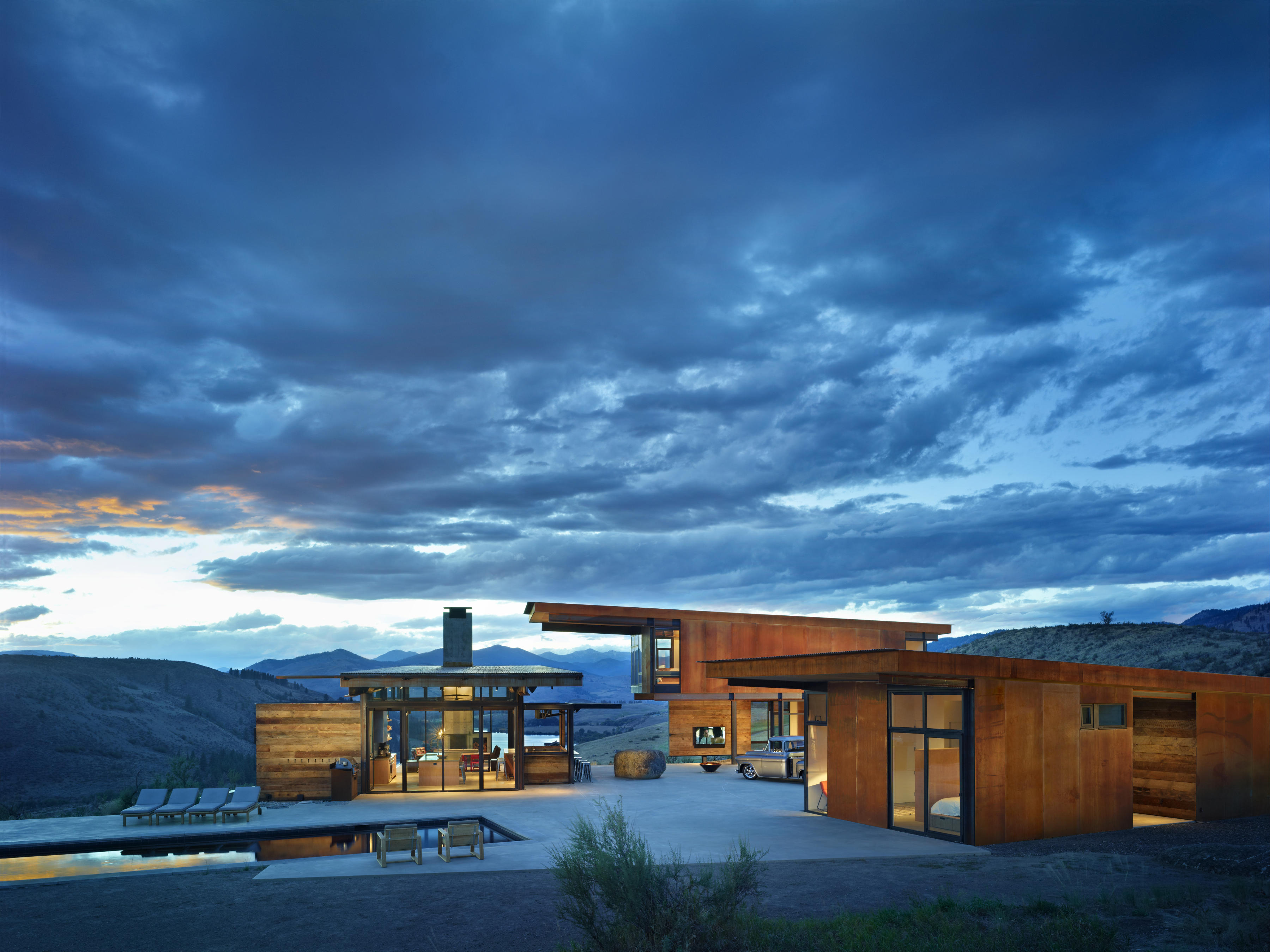 caption: Studhorse is the name of this Methow Valley home in Central Washington state. Here, compact living pavilions surround outdoor living spaces.