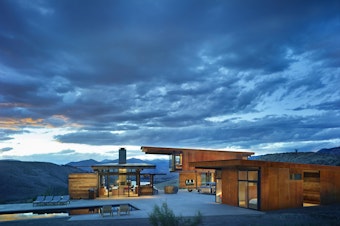 caption: Studhorse is the name of this Methow Valley home in Central Washington state. Here, compact living pavilions surround outdoor living spaces.