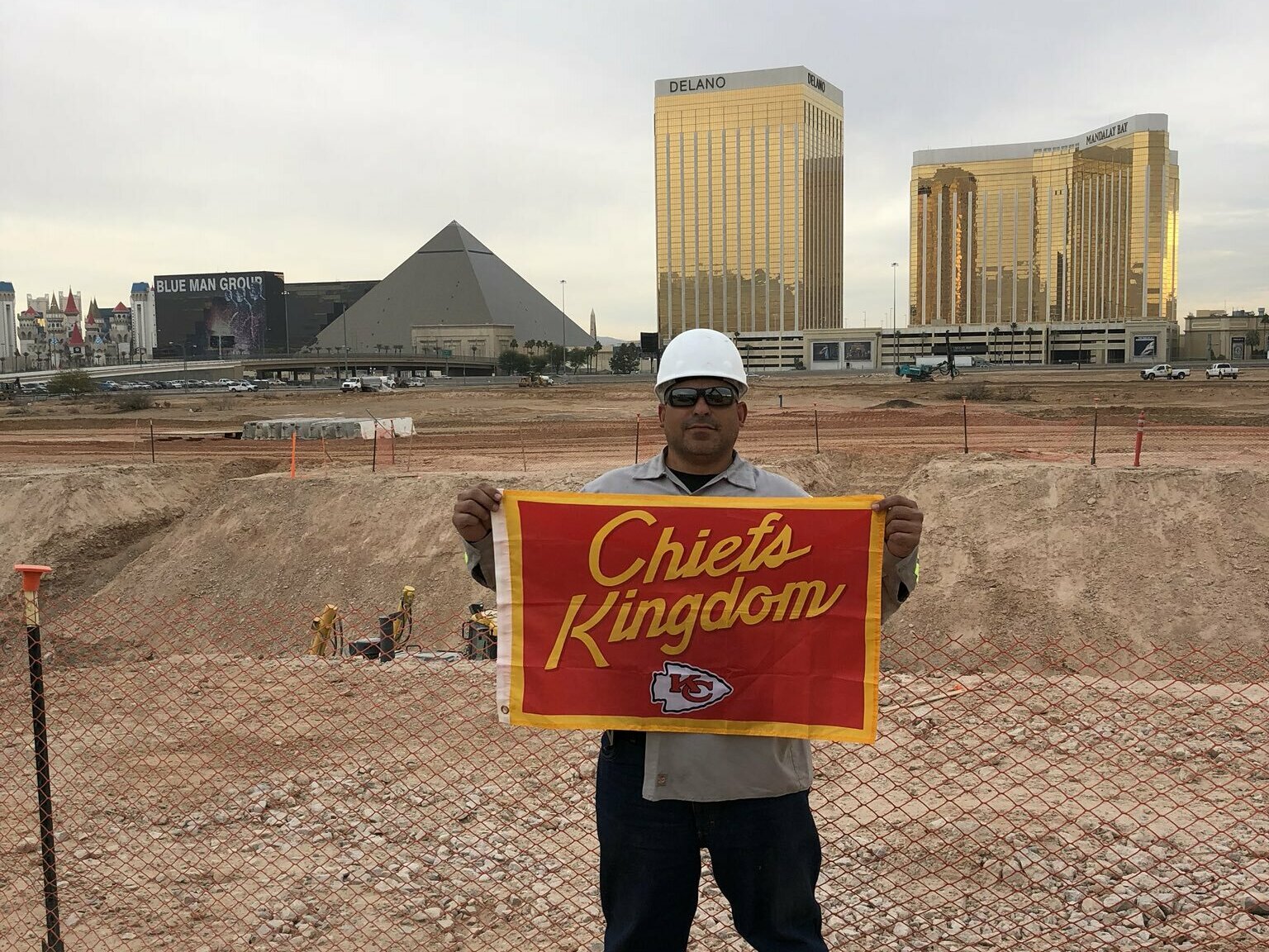 caption: The photo from the fateful text showing Gerard DeCosta with the flag he said he buried under the field at Allegiant Stadium.