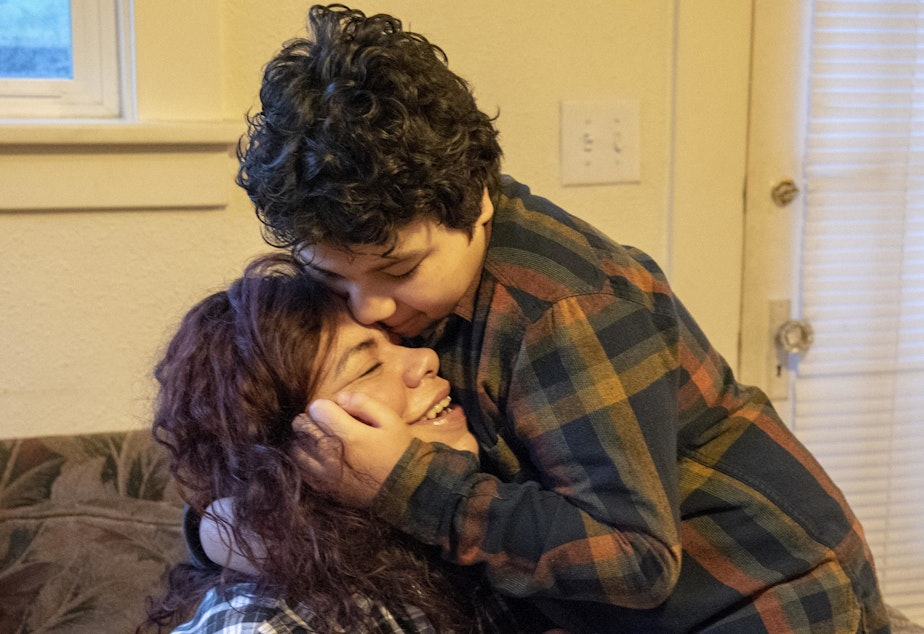 caption: Carolina Landa hugs her son, Zach, in their living room before he leaves for school on Monday, Feb. 25, 2019. The two have been living together in the same home in Olympia since 2015.CREDIT: SHAUNA SOWERSBY / THE TACOMA NEWS TRIBUNE