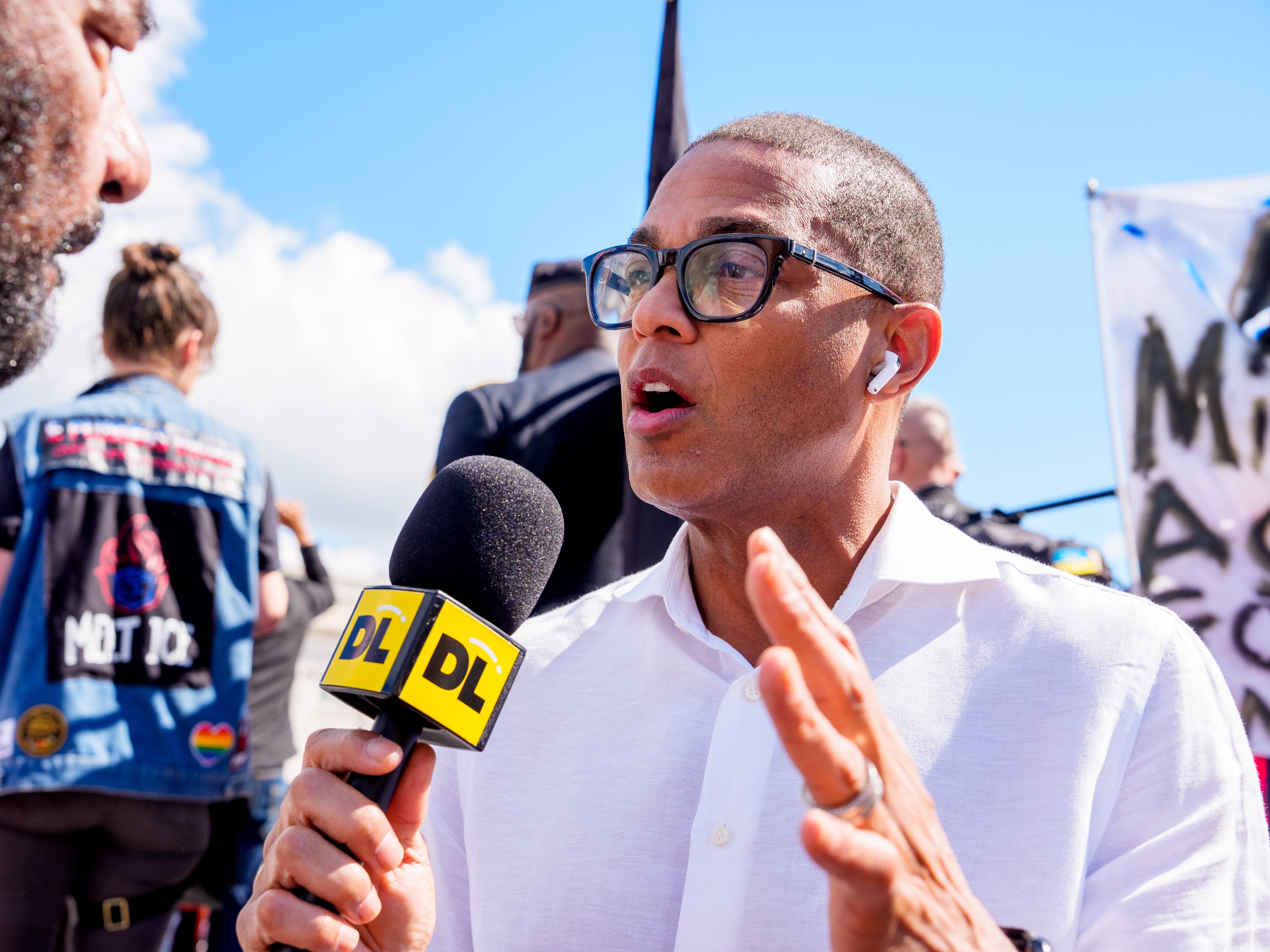caption: Journalist Don Lemon interviews Rep. Al Green (D-TX) (L) at a rally at Columbus Circle near Union Station on September 2, 2025 in Washington, DC.