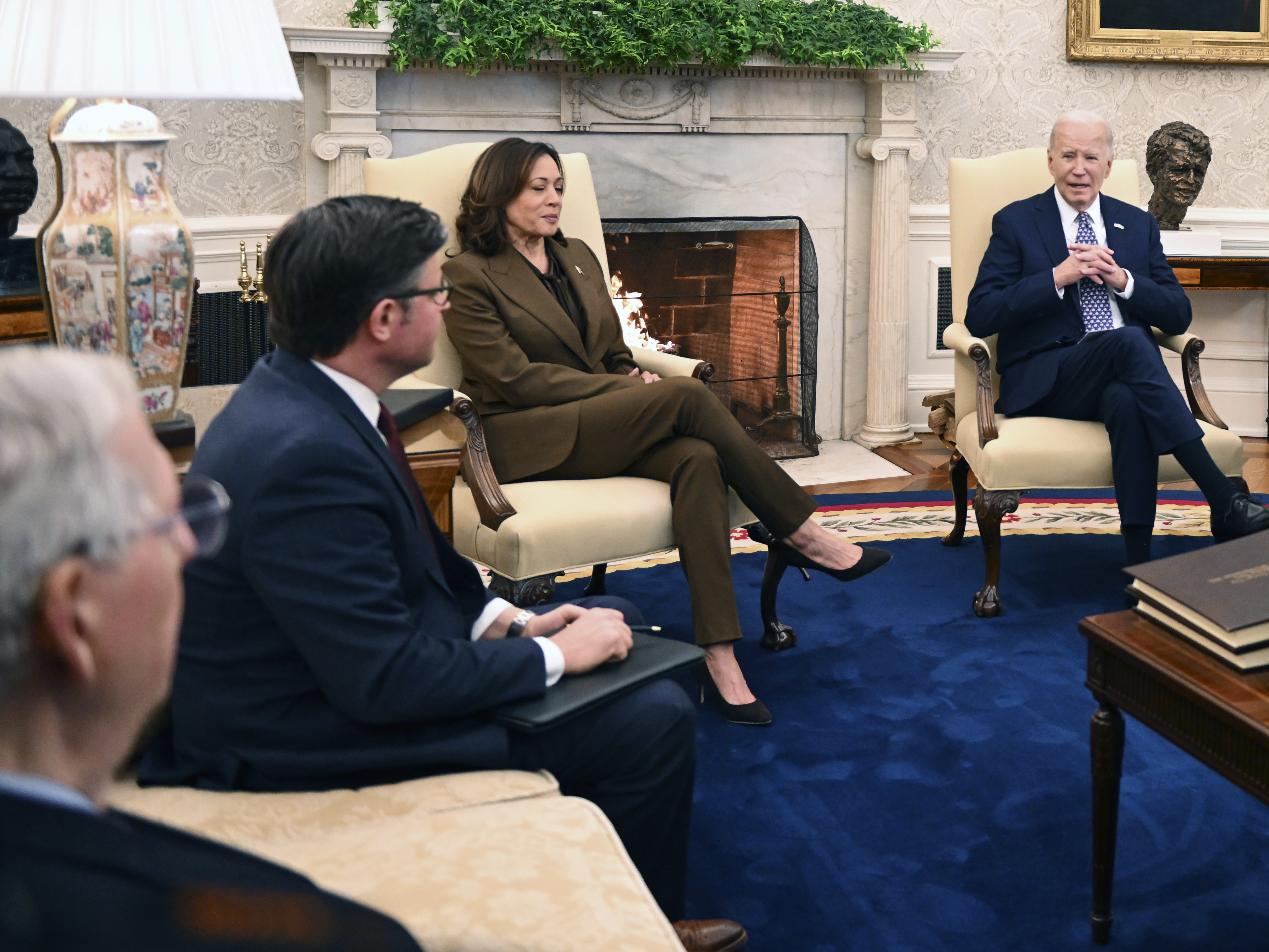 caption: President Biden and Vice President Harris met with House Speaker Mike Johnson and other top congressional leaders in the Oval Office on Feb. 27 to discuss government funding and Ukraine aid.