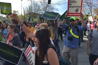 caption: Protesters rally as part of the National Day of Action for Higher Wages on Capitol Hill, Seattle, on April 15, 2015.
