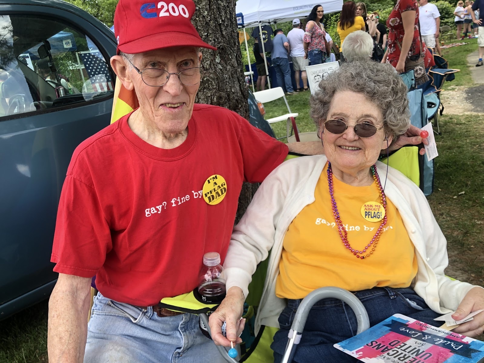 caption: Jerry Miller and his wife, Bea, at the picnic. The couple wears matching T-shirts that read "Gay? Fine by me."