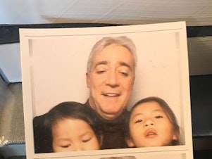 caption: Scott Simon with his daughters.