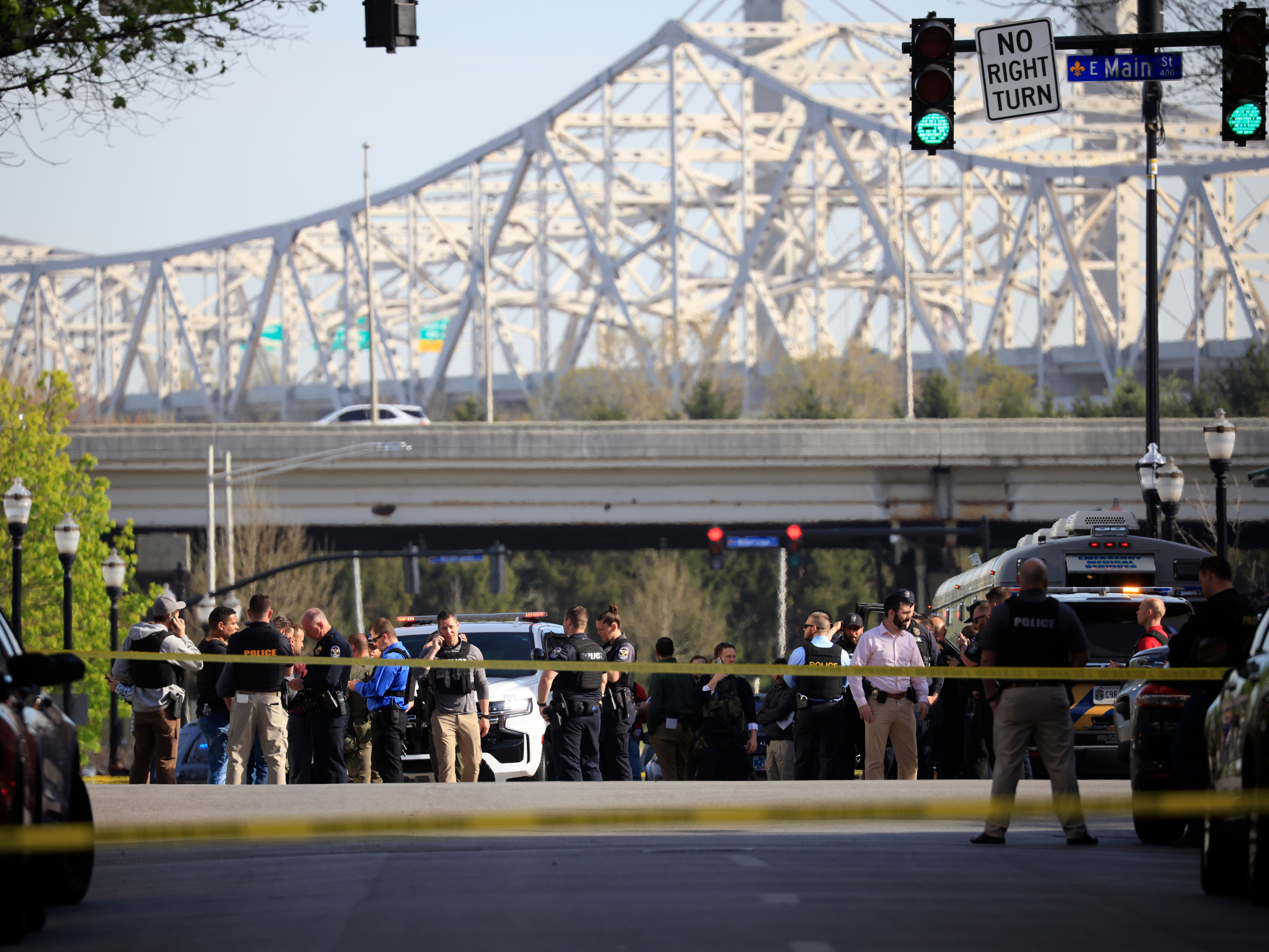 caption: Law enforcement officers respond to an active shooter near the Old National Bank building on Monday in Louisville, Kentucky.