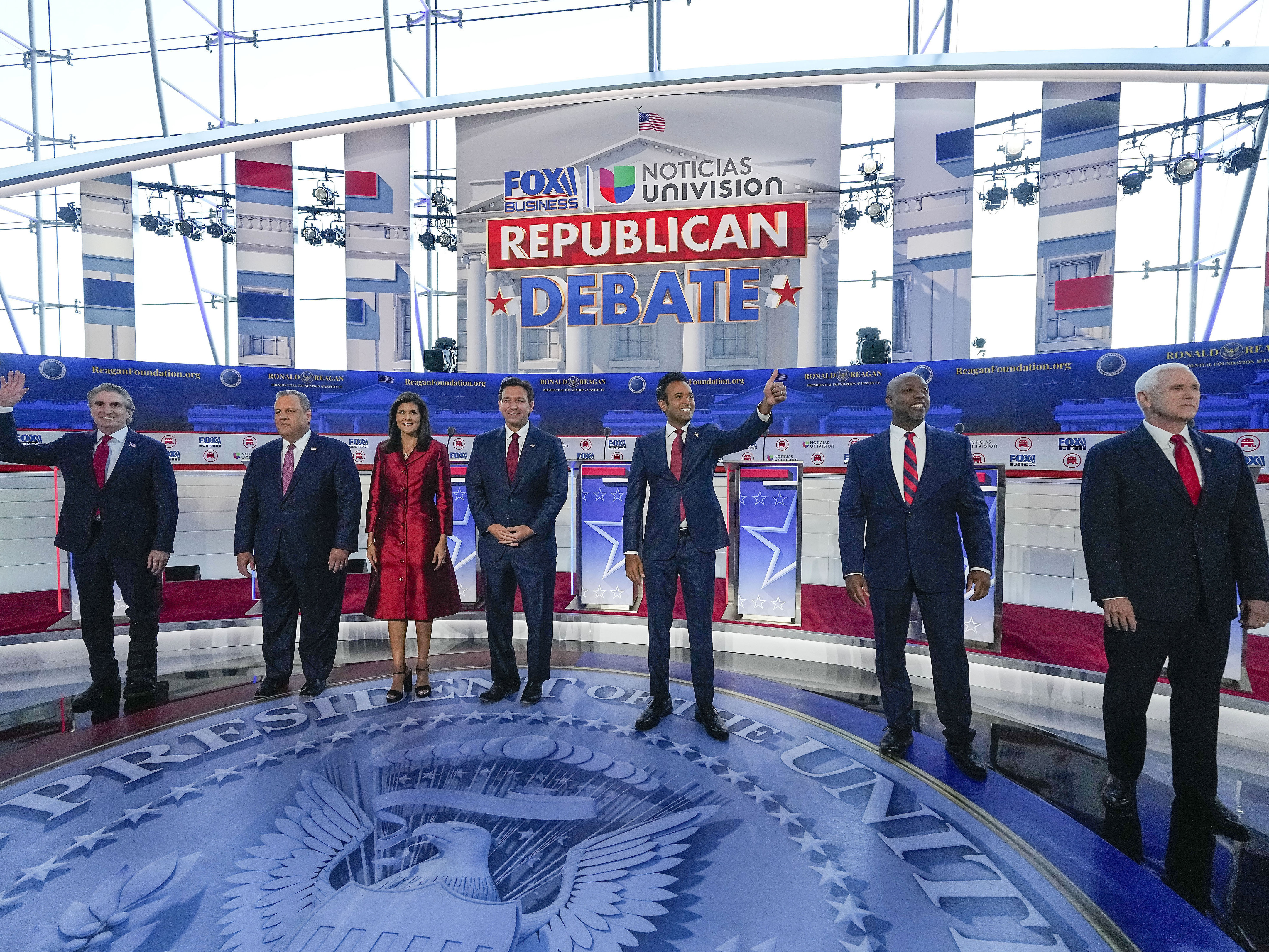 caption: Republican presidential candidates, from left, North Dakota Gov. Doug Burgum, former New Jersey Gov. Chris Christie, former U.N. Ambassador Nikki Haley, Florida Gov. Ron DeSantis, entrepreneur Vivek Ramaswamy, Sen. Tim Scott, R-S.C., and former Vice President Mike Pence, at a debate hosted by FOX Business and Univision, Wednesday at the Ronald Reagan Presidential Library in Simi Valley, Calif.